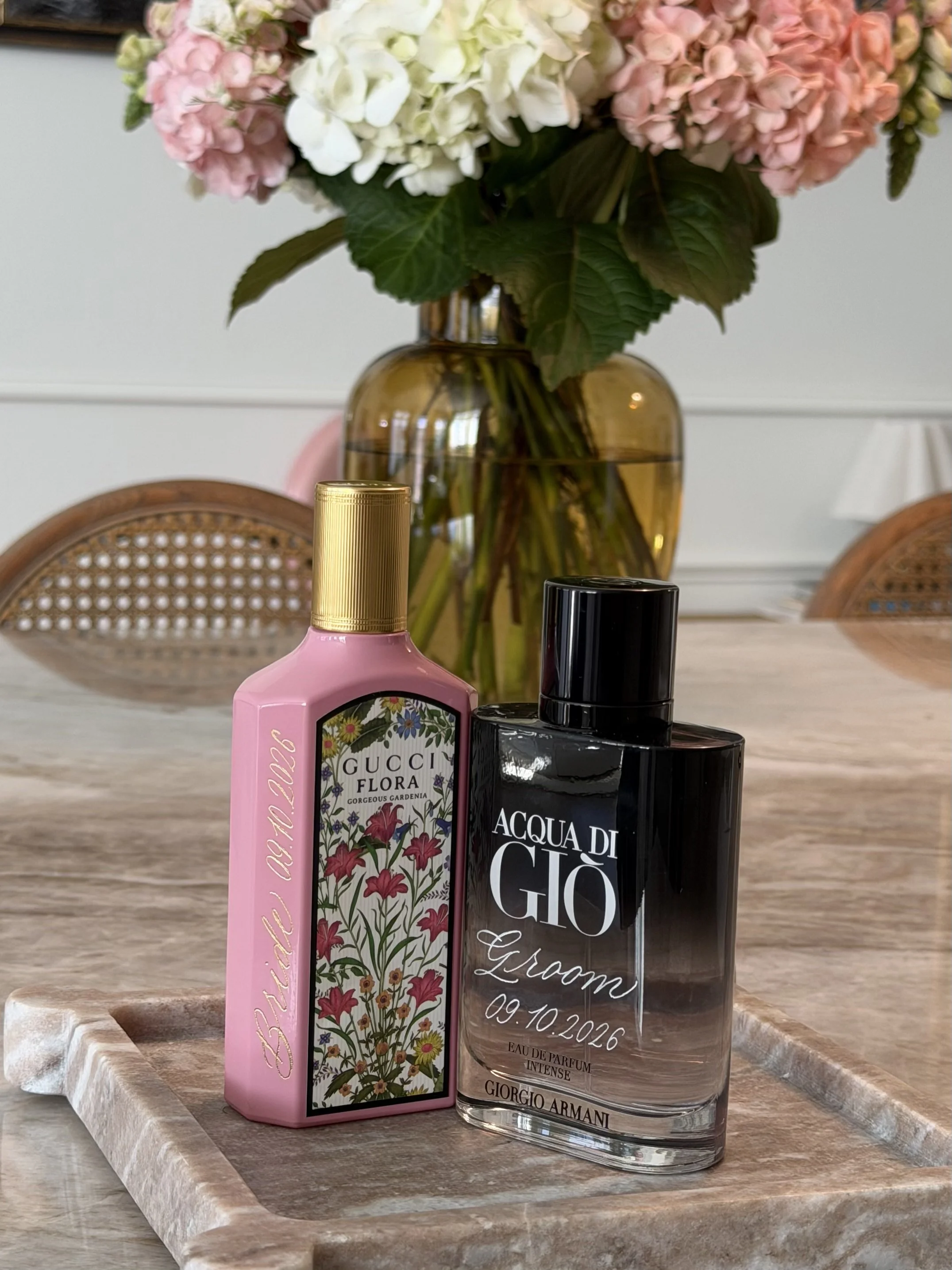 Personalized Gucci Flora and Giorgio Armani fragrance bottles with custom hand engraving.