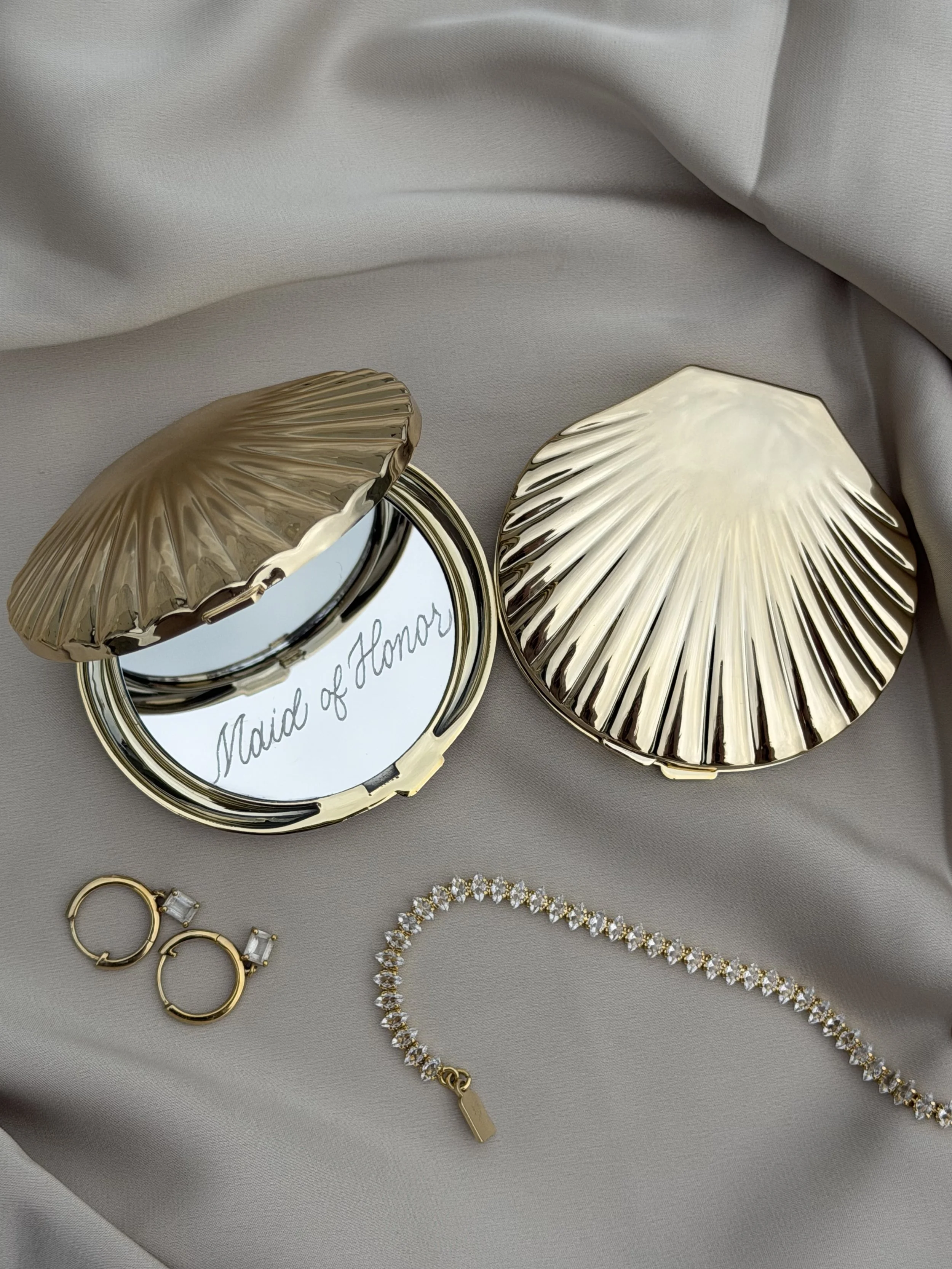 Seashell compact mirror personalized with Maid of Honor in custom gold calligraphy.