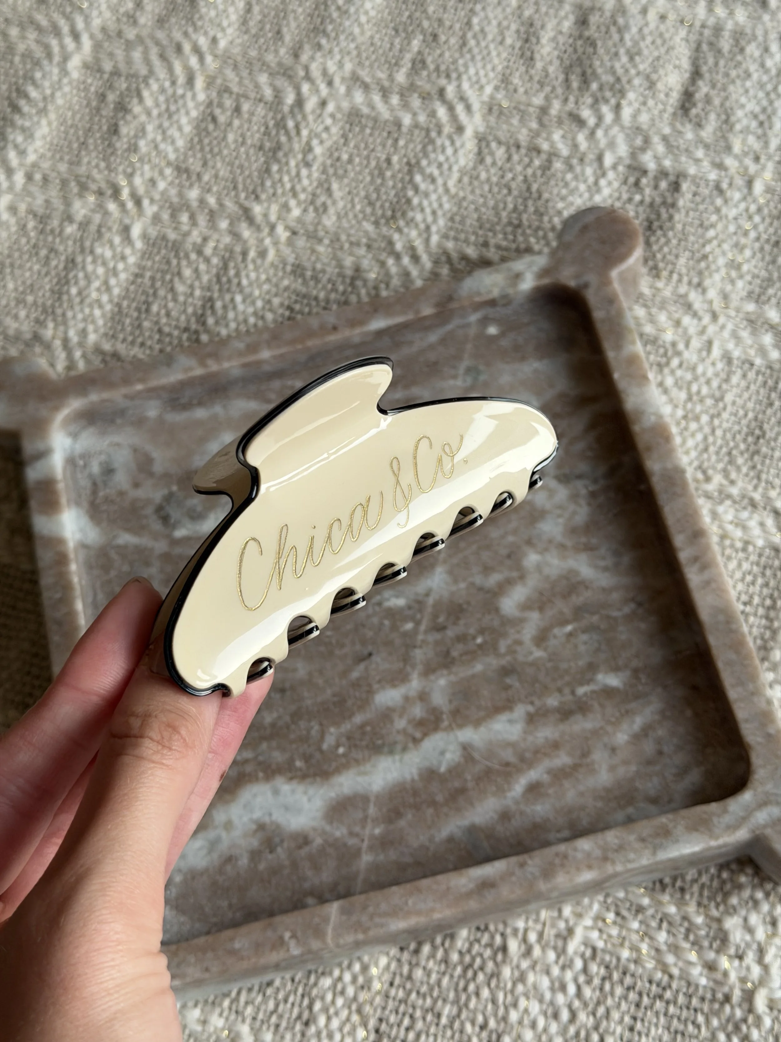 Personalized claw clip with Chic and Co. in custom gold calligraphy.