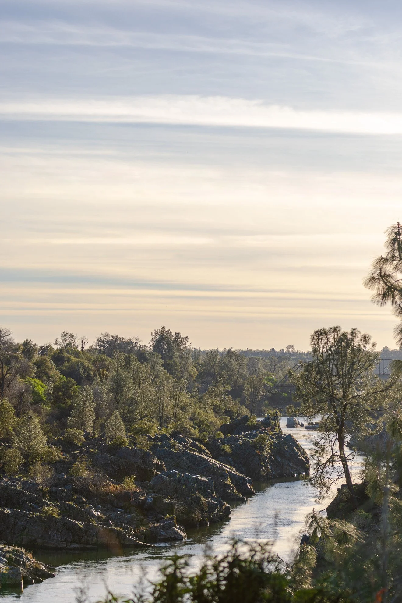 River flowing through California foothills, reflecting the patient and steady approach of South Fork Operations Co. to business support