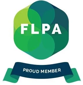FLPA logo with overlapping green and teal circles and a blue ribbon stating 'PROUD MEMBER'.