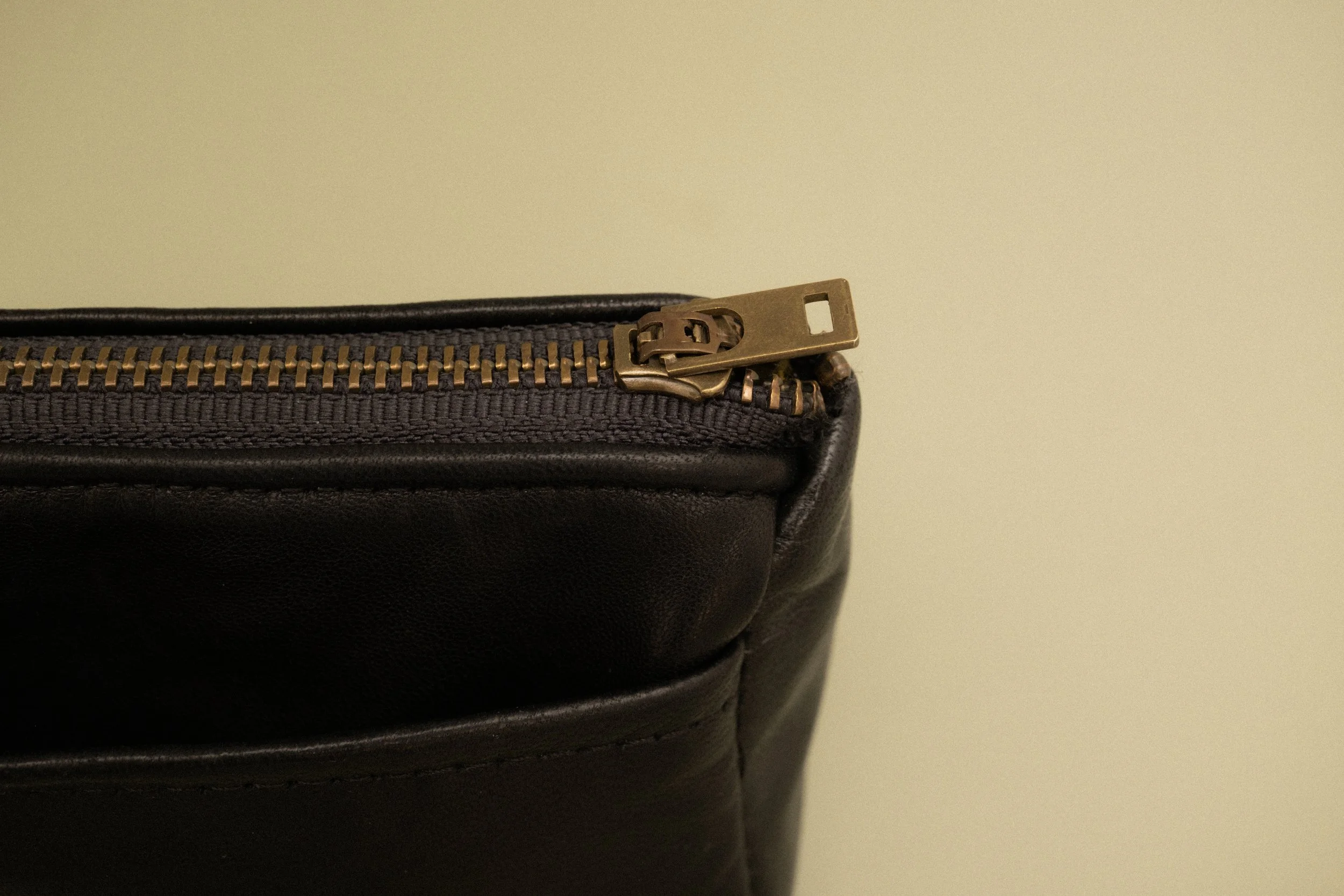 The Mini Handy Zipper Pouch in Black- 1 left. Item being discontinued.