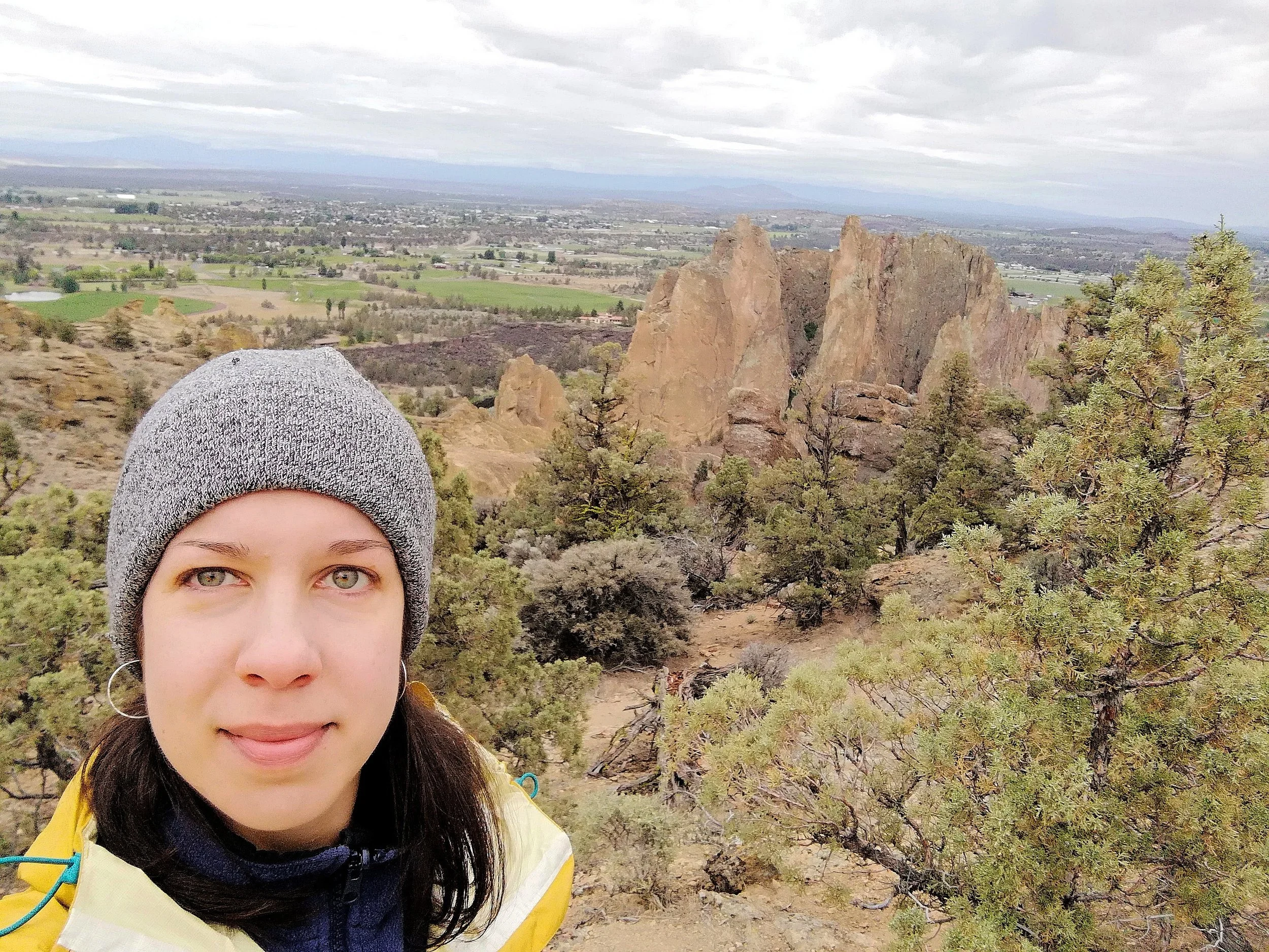 Carla hiking with rock formats in the background