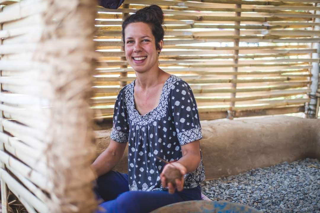 Carla building a structure with clay