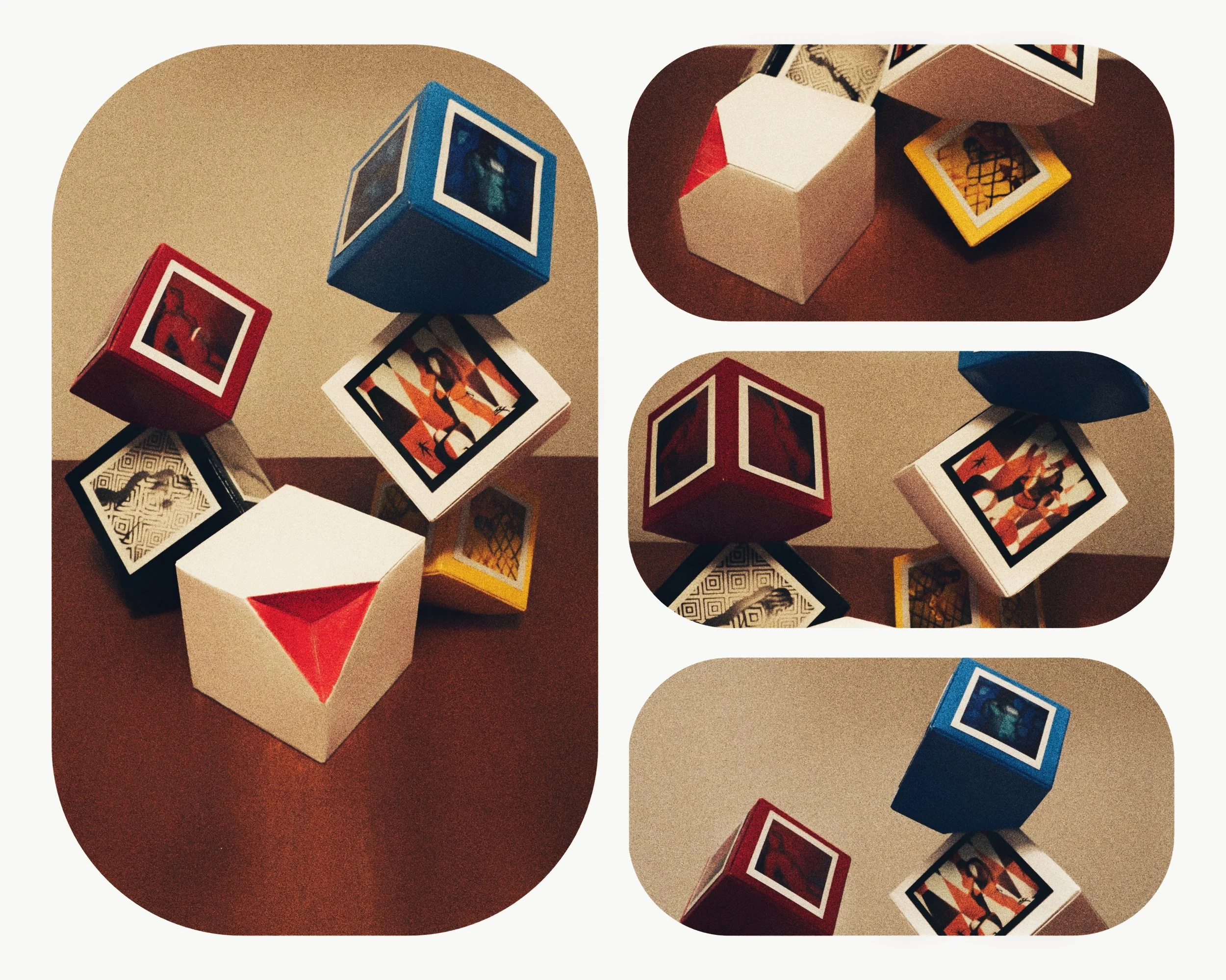 Collection of colorful geometric blocks featuring optical illusion artwork, including cubes and rectangular prisms on a brown surface with a beige background.