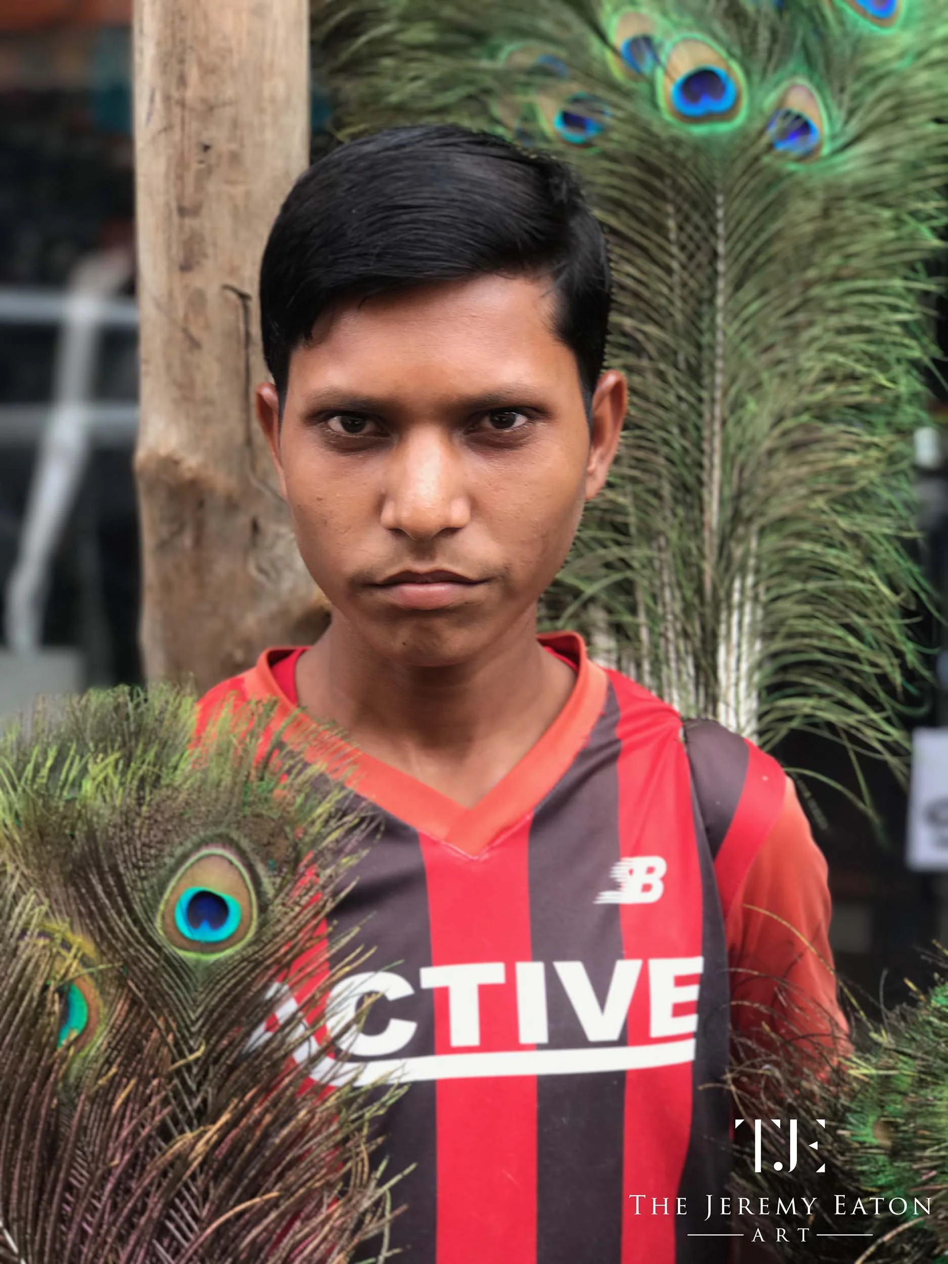 Boy & Peacock Feathers