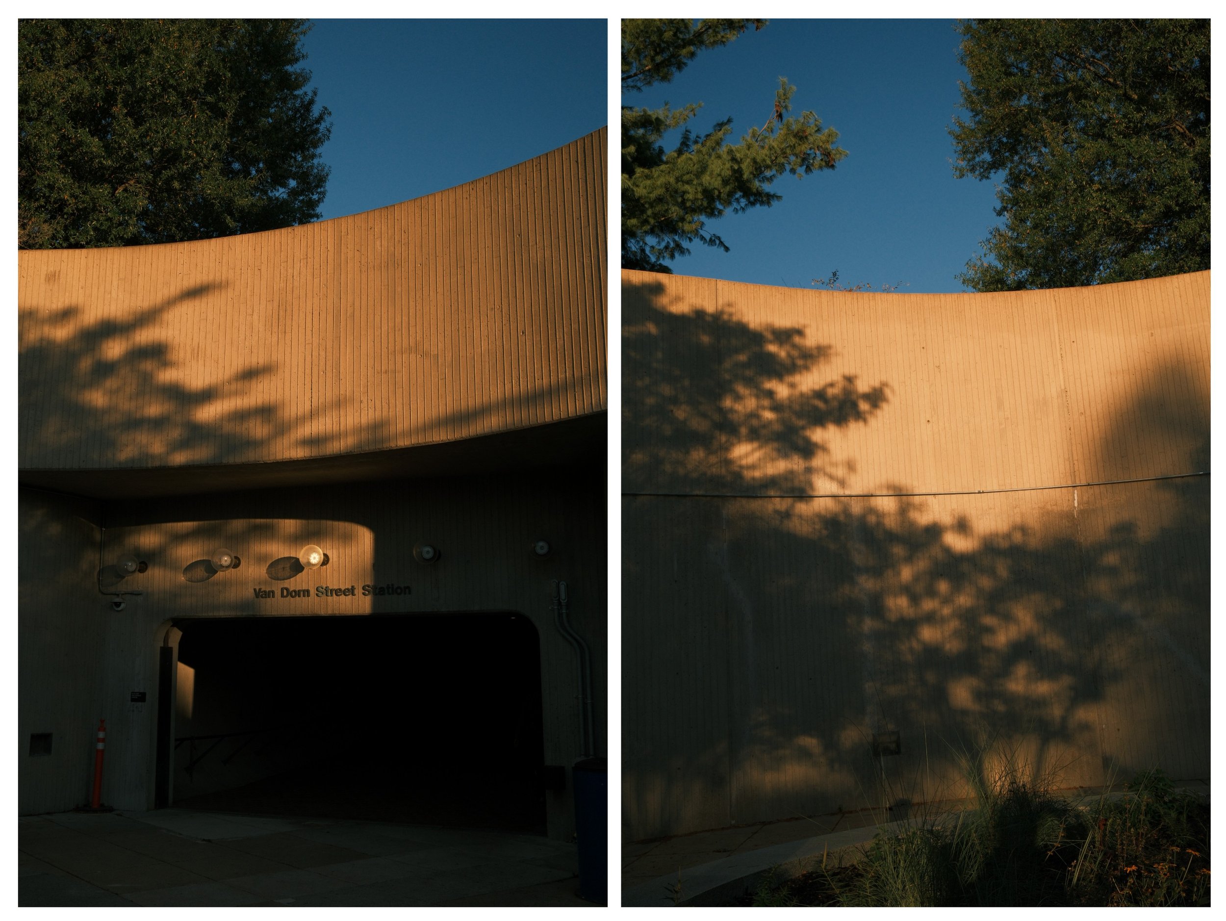 A split image showing the exterior of Van Dorn Street Station with a beige curved building wall. The left side shows a darker entrance area with lights, while the right side displays shadows of trees cast on the wall at sunset, with a clear blue sky 