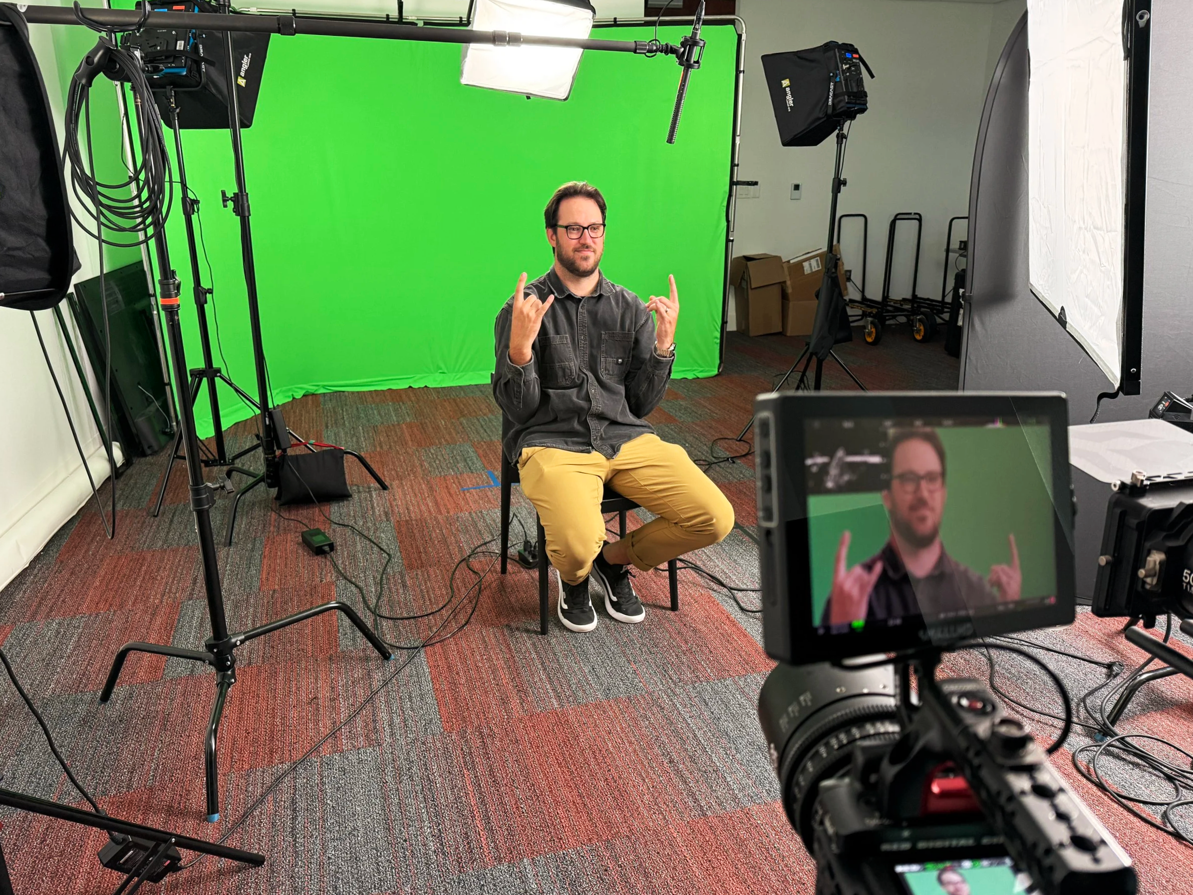 Patrick Johnson cinematographer sitting in so client can approve the look for this green screen interview setup for Daydream Studio in Richmond, VA.