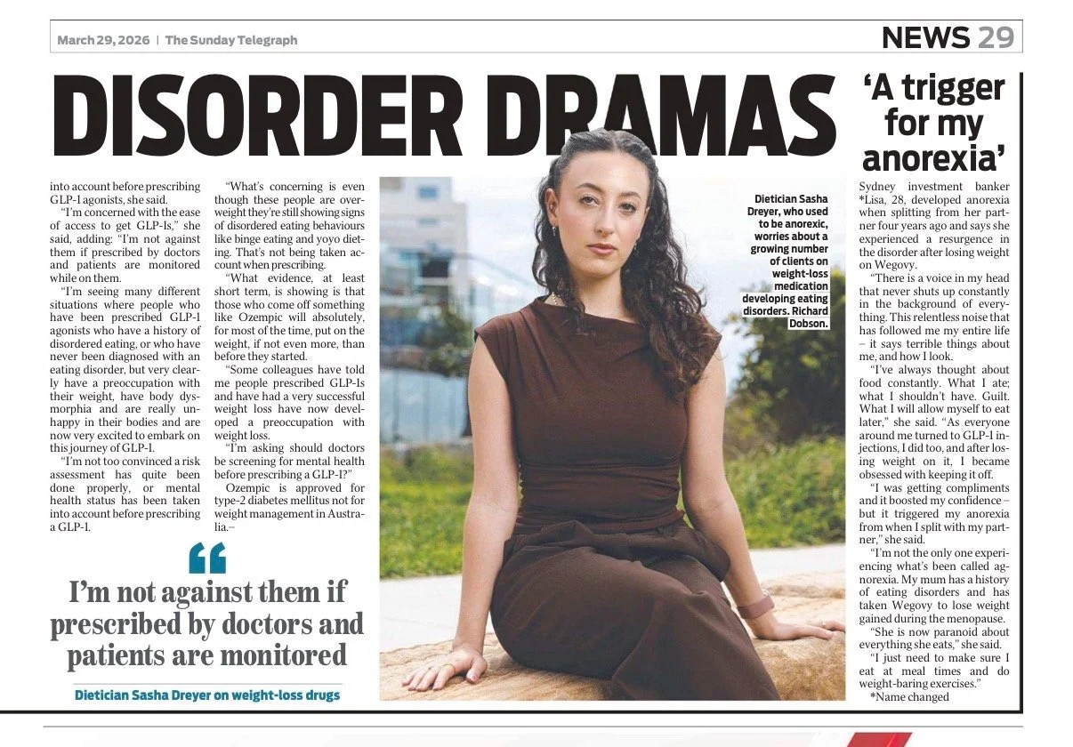 A newspaper page from The Sunday Telegraph dated March 29, 2026, with the headline "Disorder Dramas." The page features a large photo of a young woman with long, dark, curly hair, sitting outdoors on a rock, wearing a sleeveless brown dress, with a blurred background of trees and a cityscape. The article discusses issues related to eating disorders, weight-loss drugs, and a woman named Sasha Dreyer's perspective on prescribed medication and monitoring.