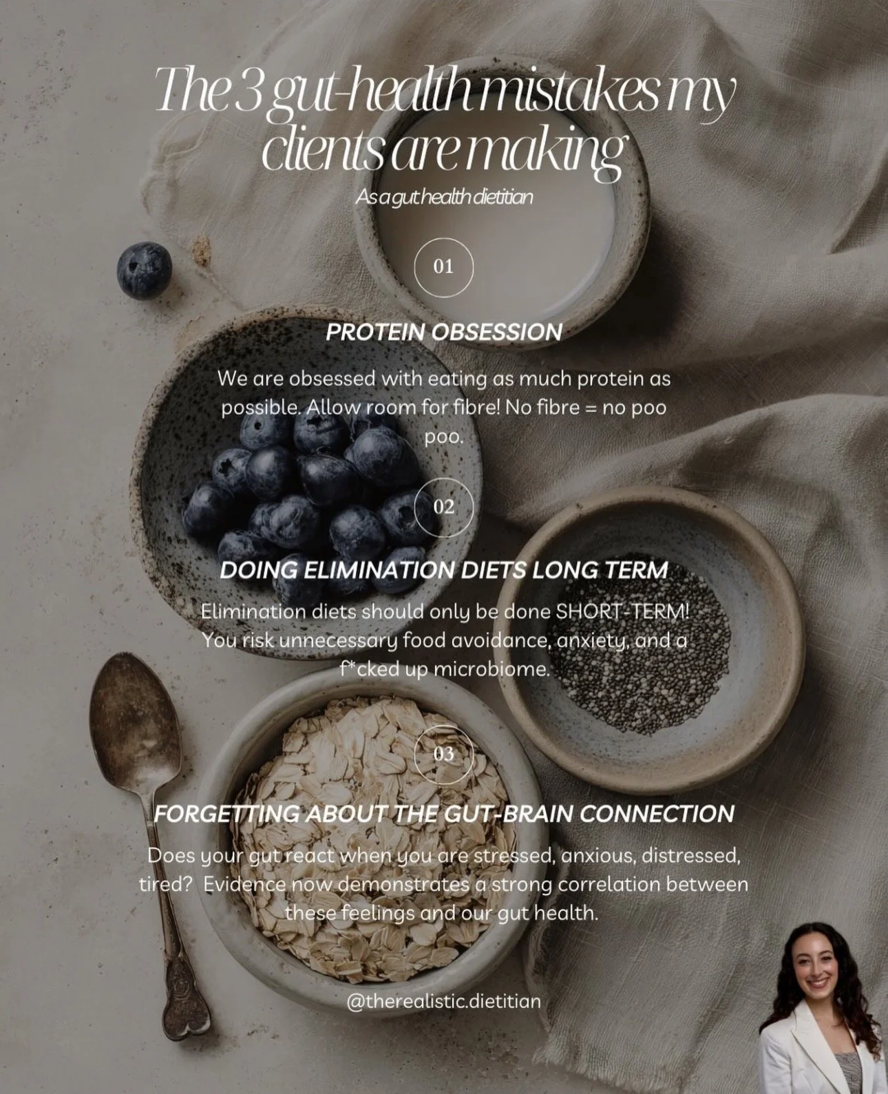 Aesthetic flat lay of bowls containing blueberries, chia seeds, oats, and a cup of milk on beige fabric background with a woman in the bottom right corner.