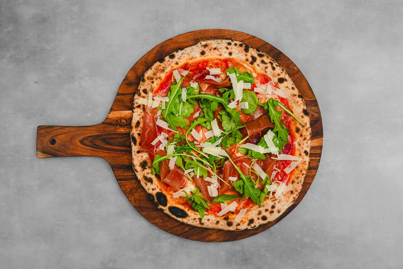 Prosciutto 
- Sauce, Fior Di Latte, Prosciutto, Fresh Rocket, Herb Oil 