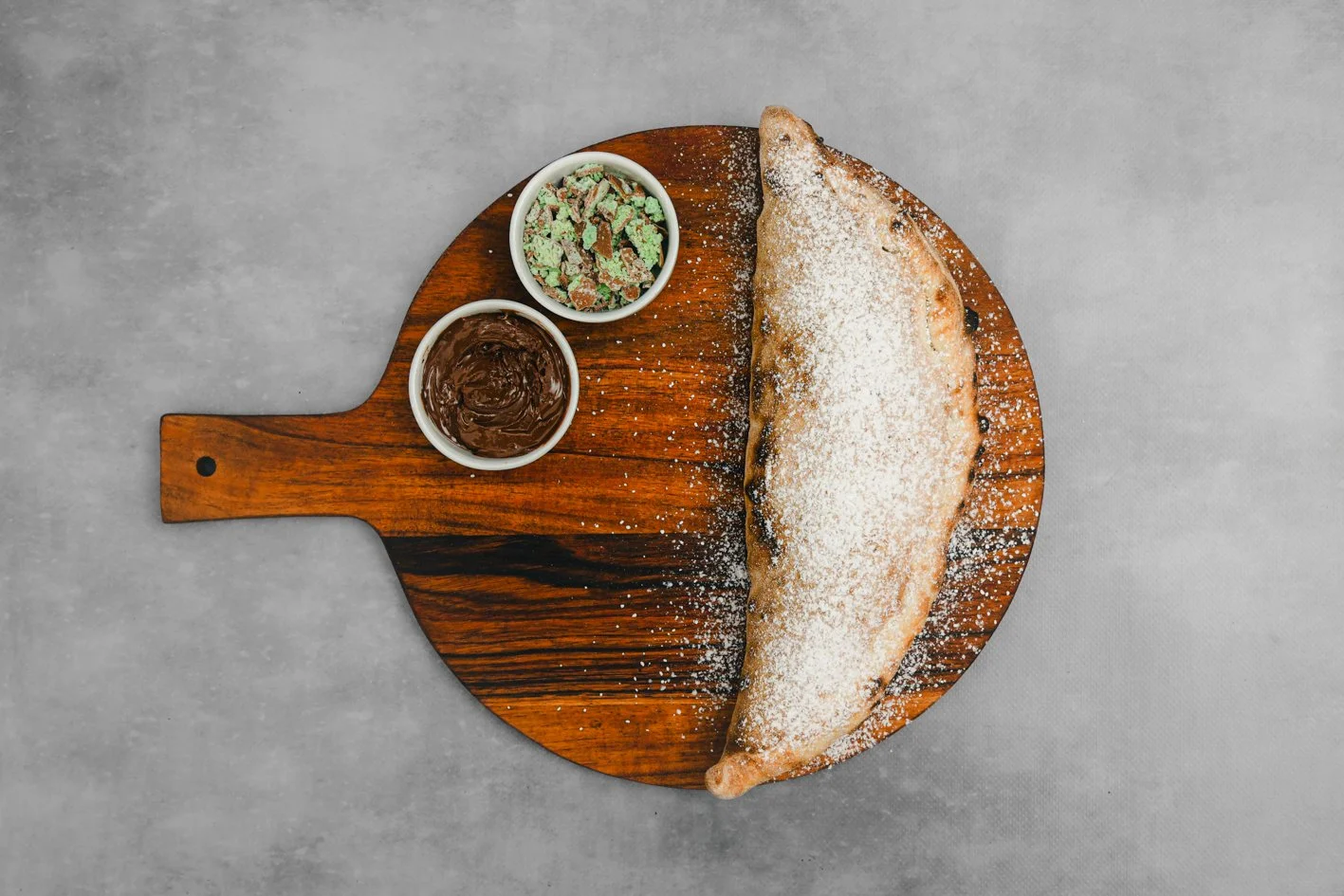 Mint Aero Calzone 
- Nutella, Mint Aero Chocolate, Icing Sugar 