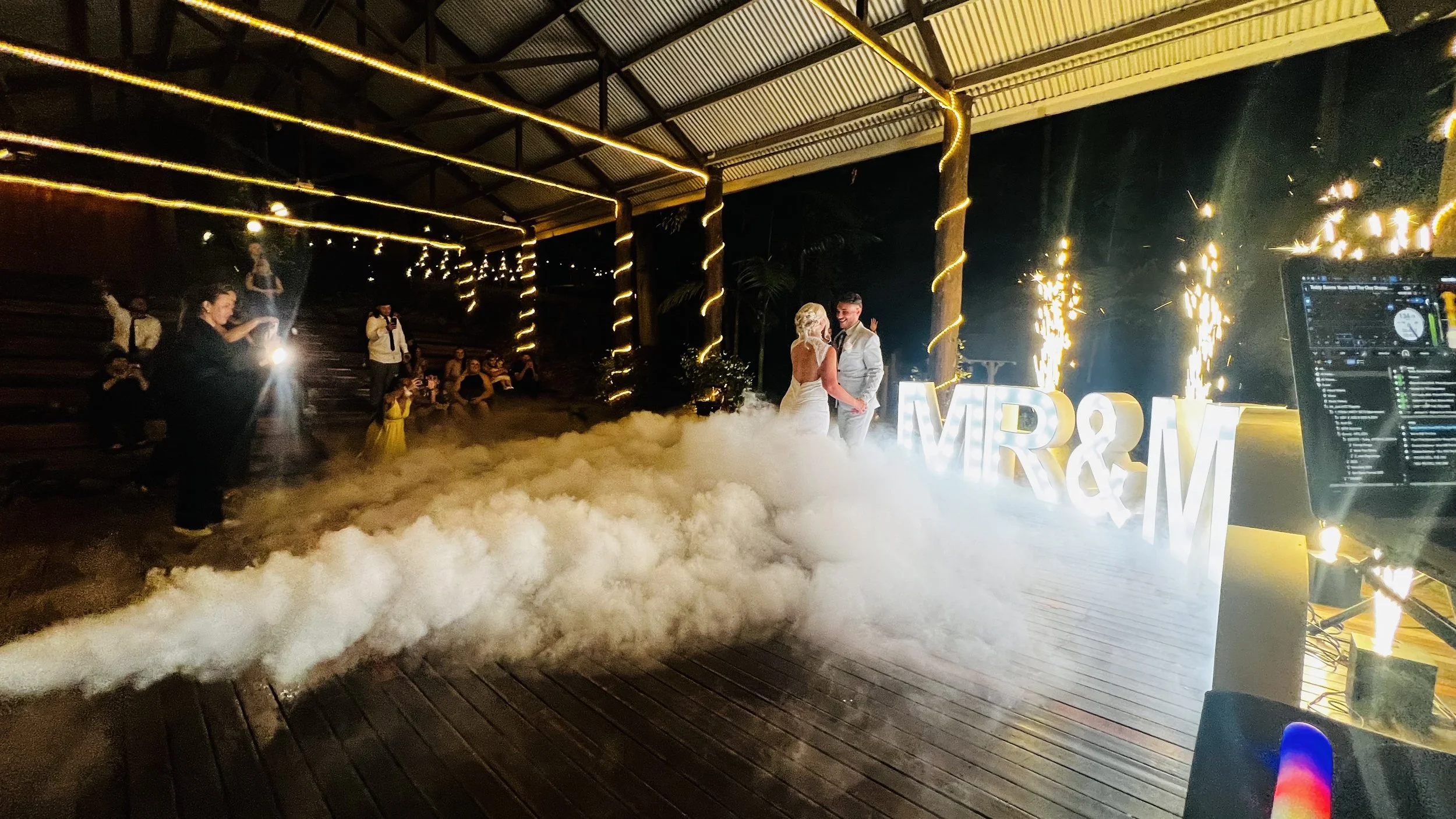 NuFlava Entertainment - wedding DJ performing during first dance including sparklers and dancing on a cloud effect