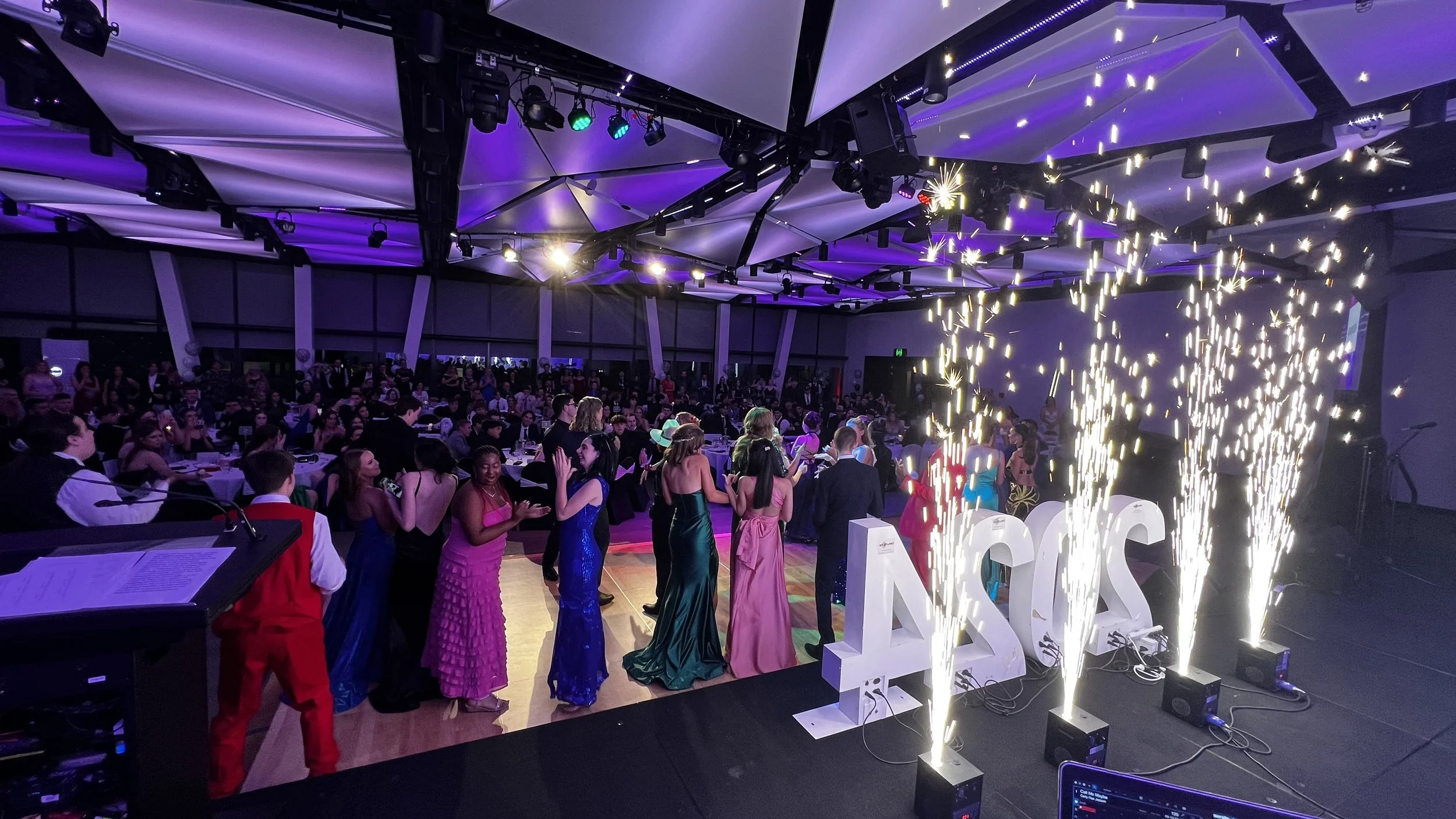 School formal and graduation DJ services with age-appropriate music, wireless microphones and event lighting.