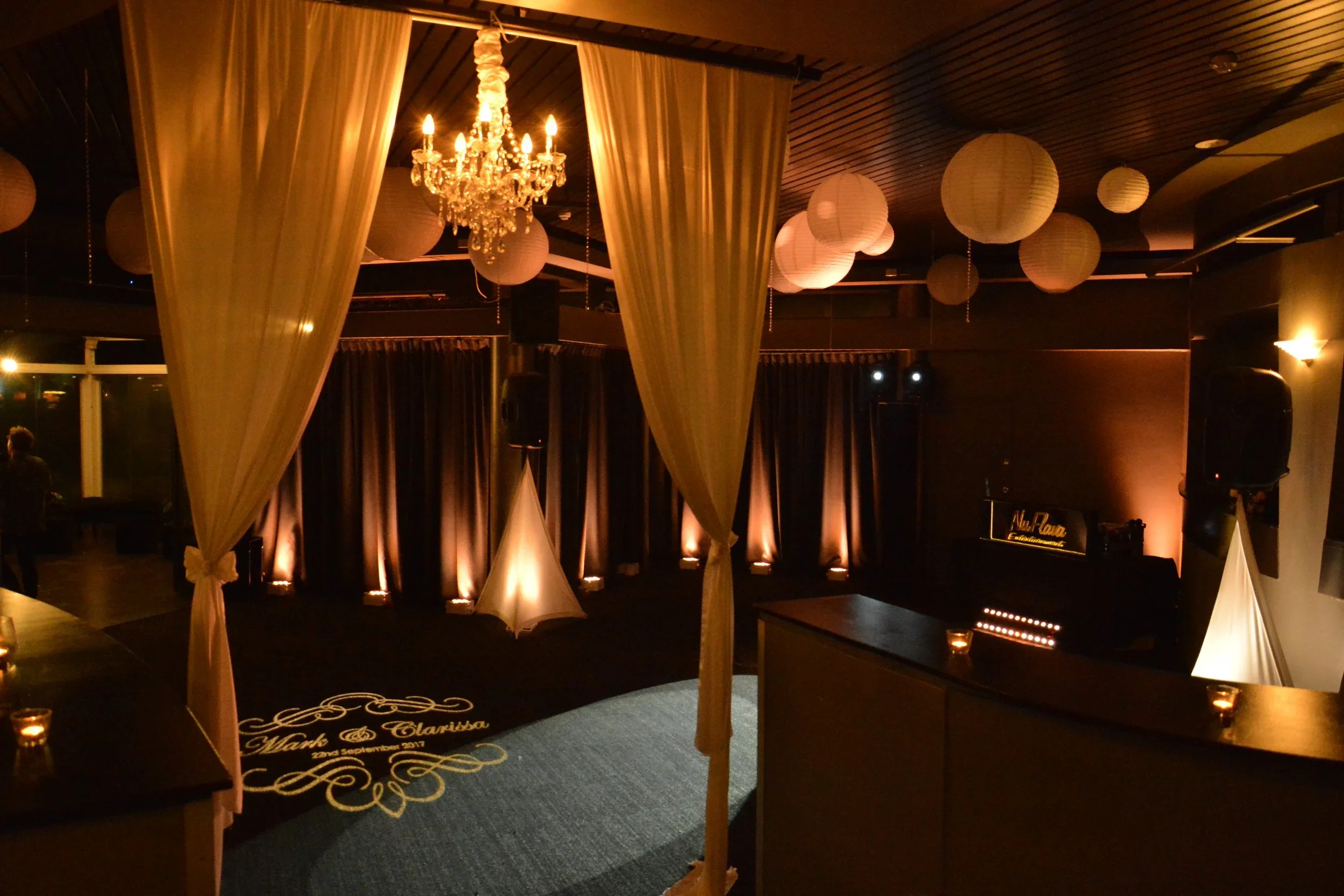 Elegant wedding reception with professional DJ entertainment, premium sound, dancefloor lighting and ambient uplighting
