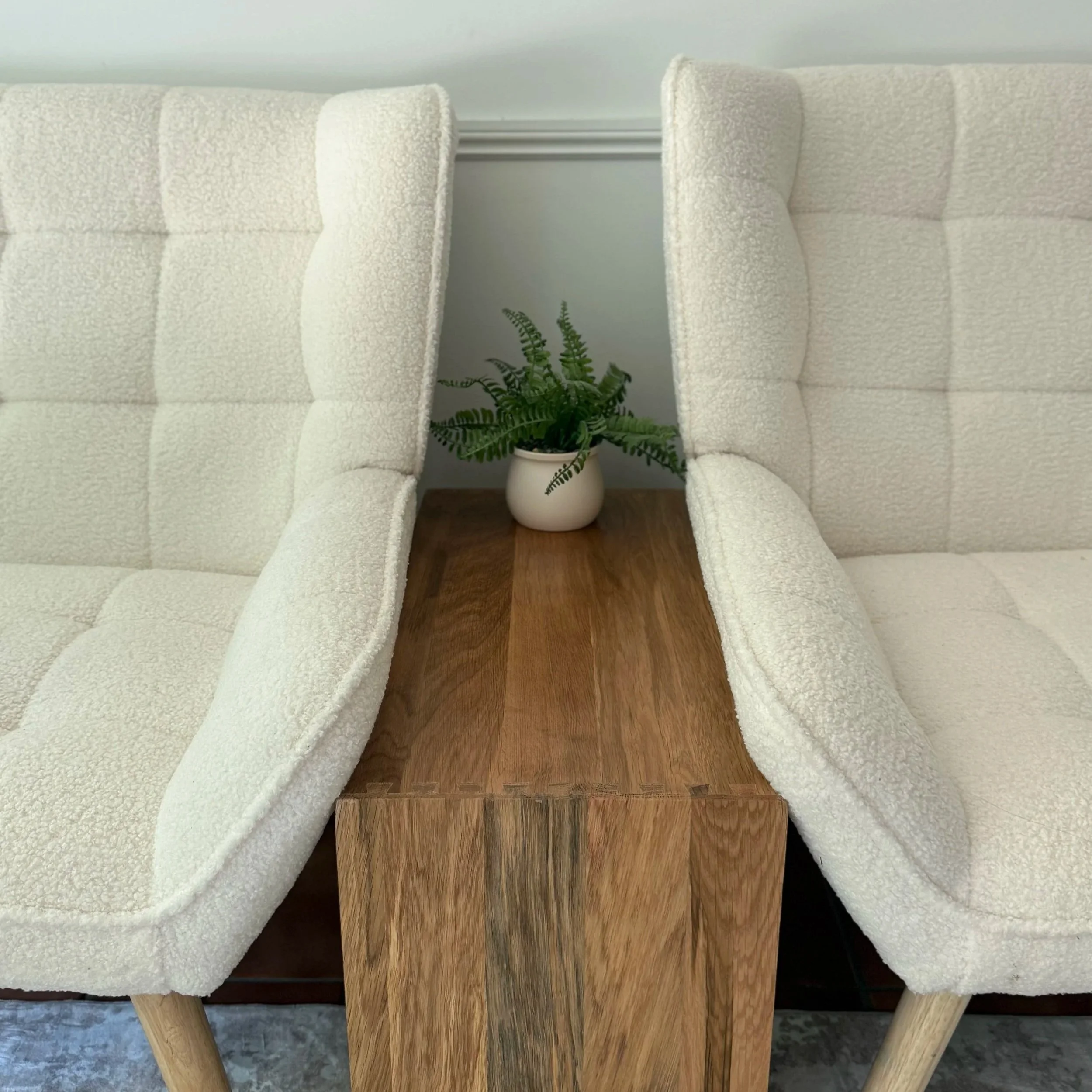 Two chairs facing each other in a calm therapy space at Clinically Speaking Psychology