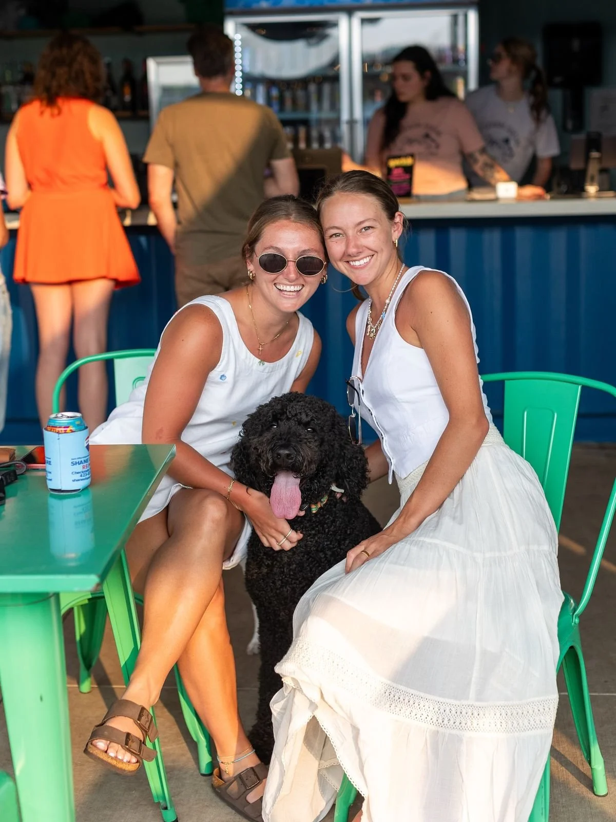 Women enjoying drinks at the outdoor bar at Off Leash Social in Johnson City, TN