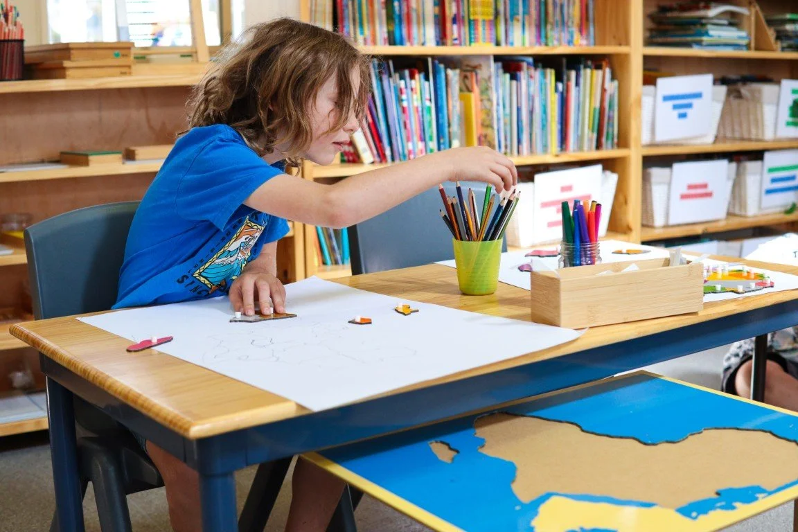 A lower primary student working on Geography