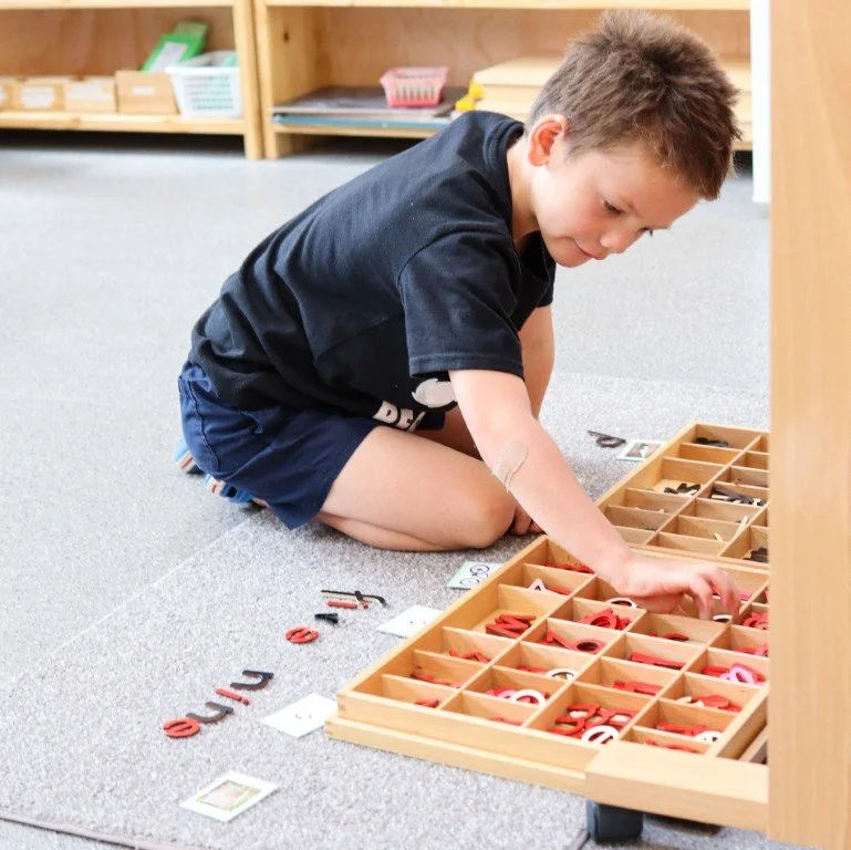 A Lower Primary student working on language