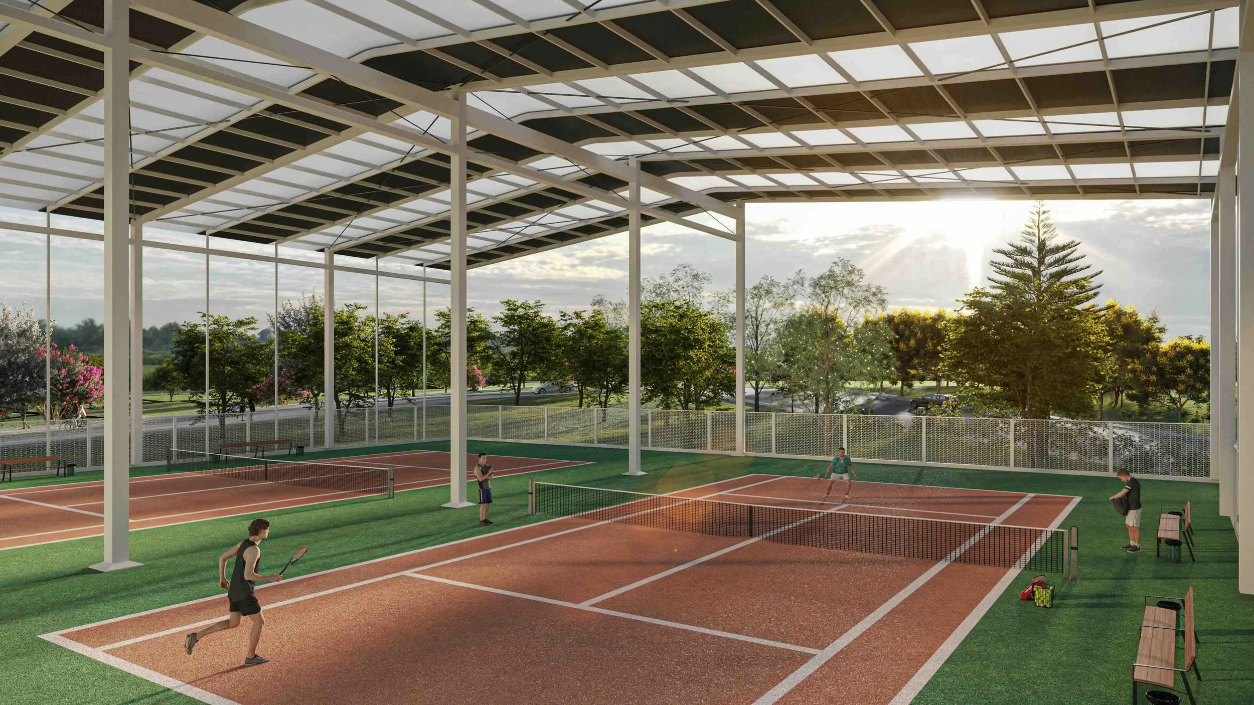An artist perspective of one of Susana Heights amenities: Indoor tennis courts with four players, net in the middle, and a solar panel roof. Outdoors, trees and parked cars are visible in the background.