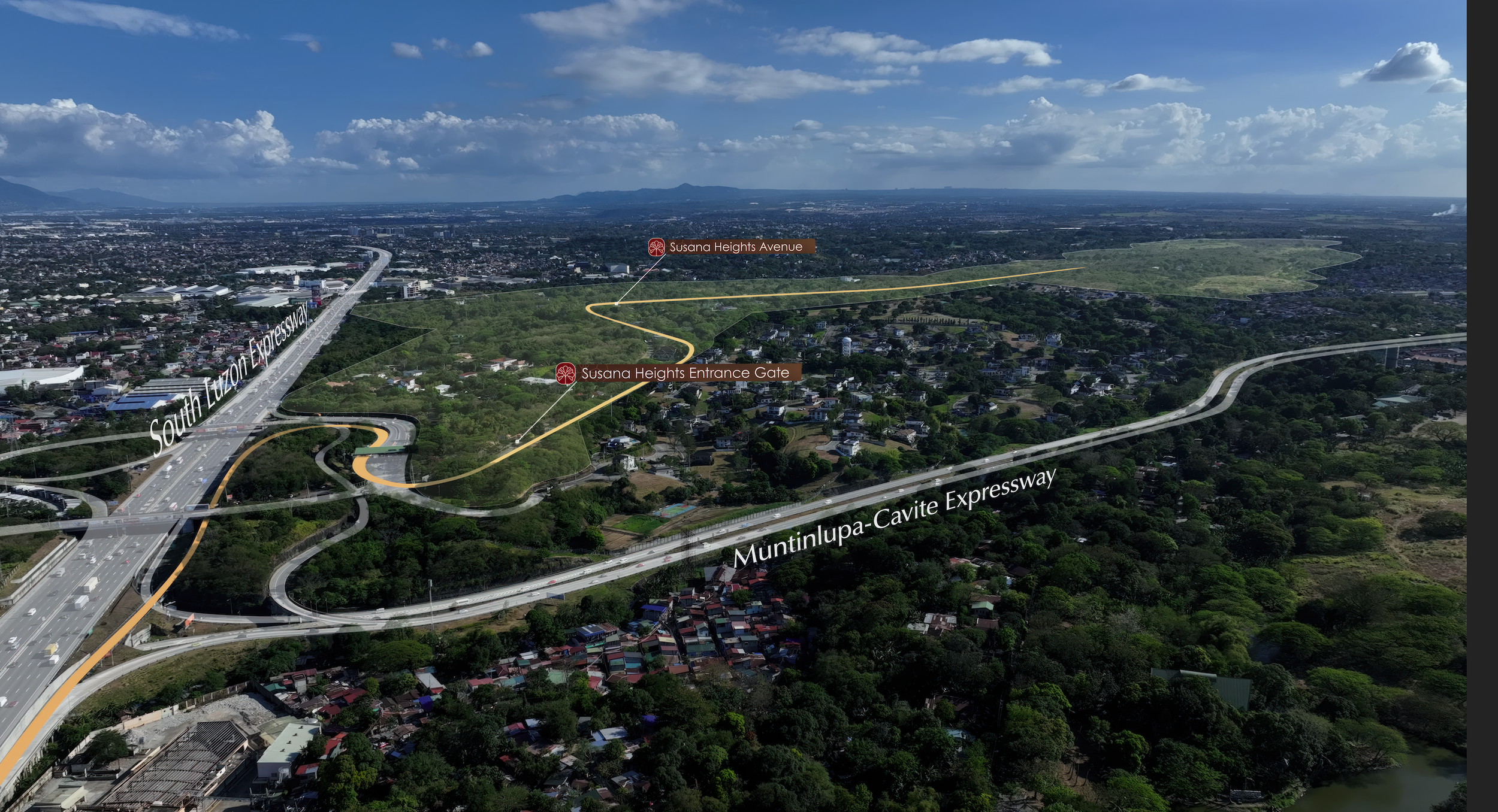 Aerial view of the Susana Heights area showing the Susana Heights Entrance Gate, Susana Heights Avenue, South Luzon Expressway, and Muntinlupa-Cavite Expressway with a cityscape, greenery, and partly cloudy sky in the background.