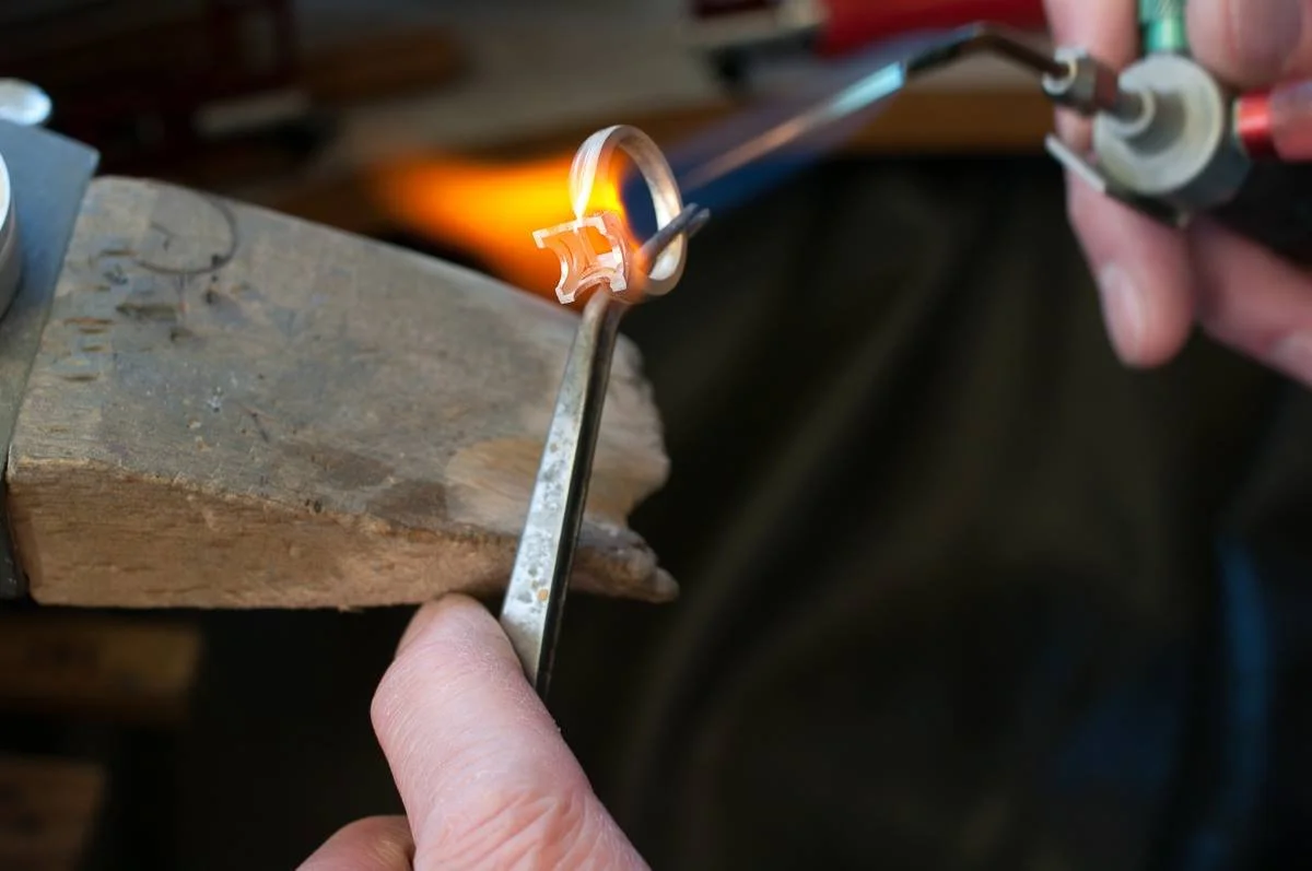 Brian using a blow torch to mould a ring