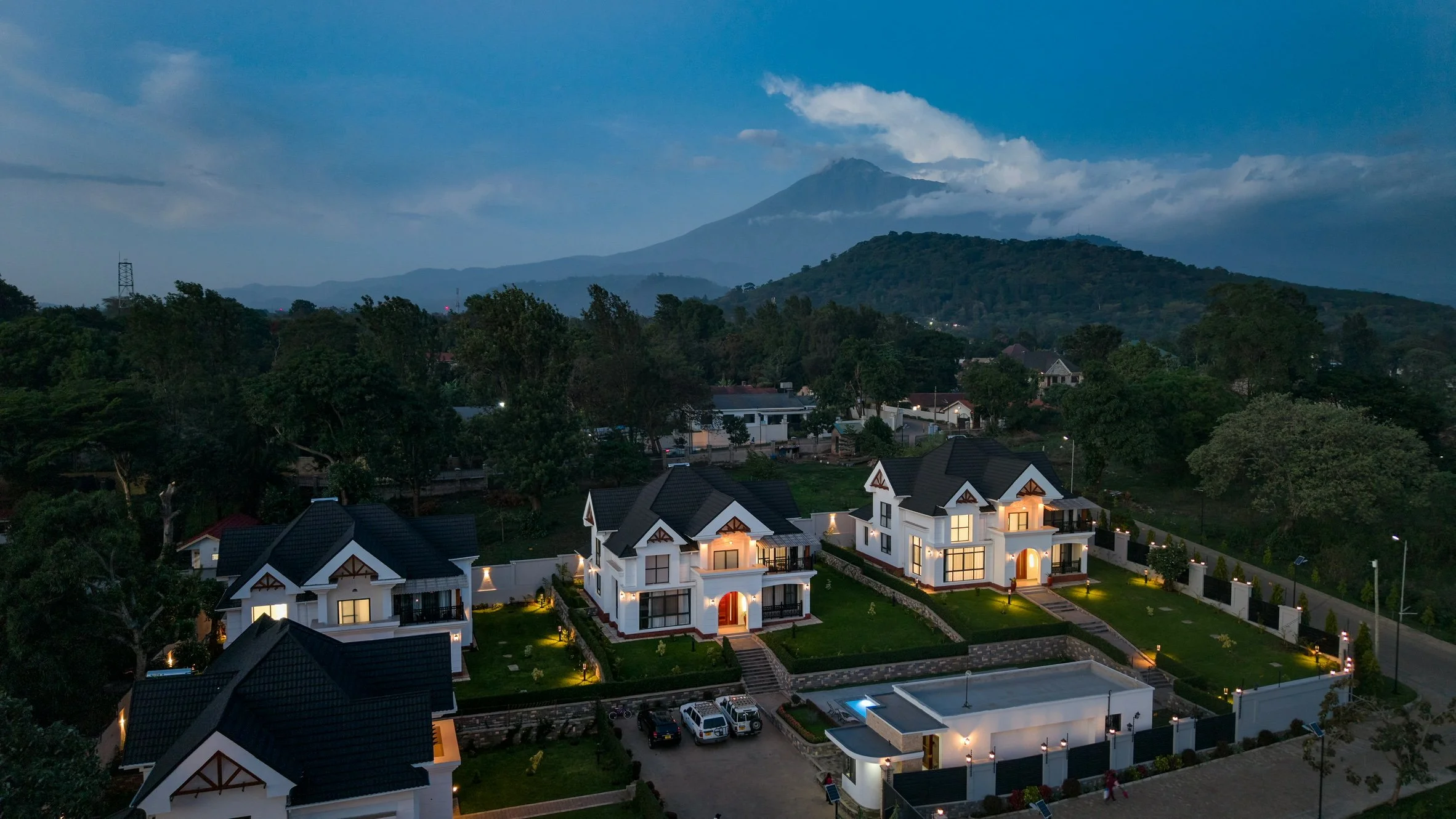 Drone view of the Kibo Homes Arusha four-villa luxury compound with Mount Meru behind