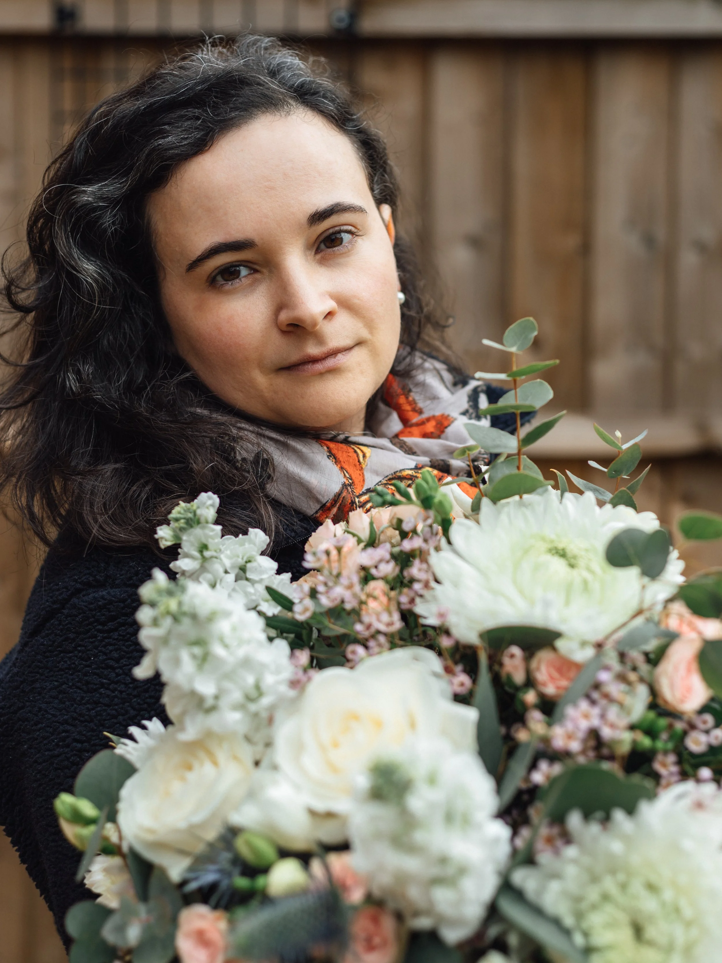 Florist holding a bouquet of flowers