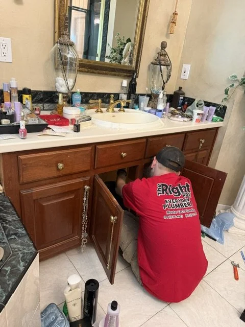 Nico installing a new faucet.