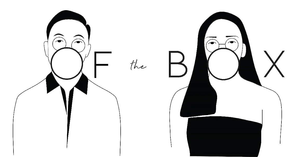 A chalkboard drawing of a man and woman wearing face masks, with the words 'F the B X' written between them.