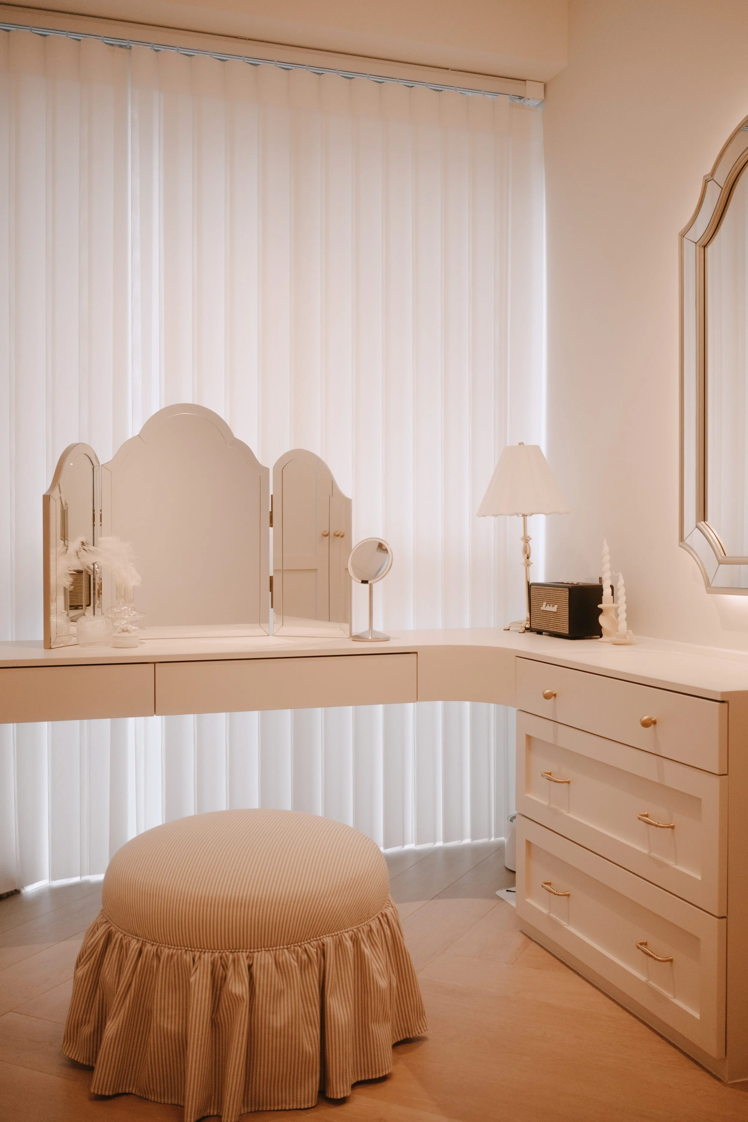 Ripple Blinds in a cream-toned vanity area, softly filtering natural light behind a dressing table.