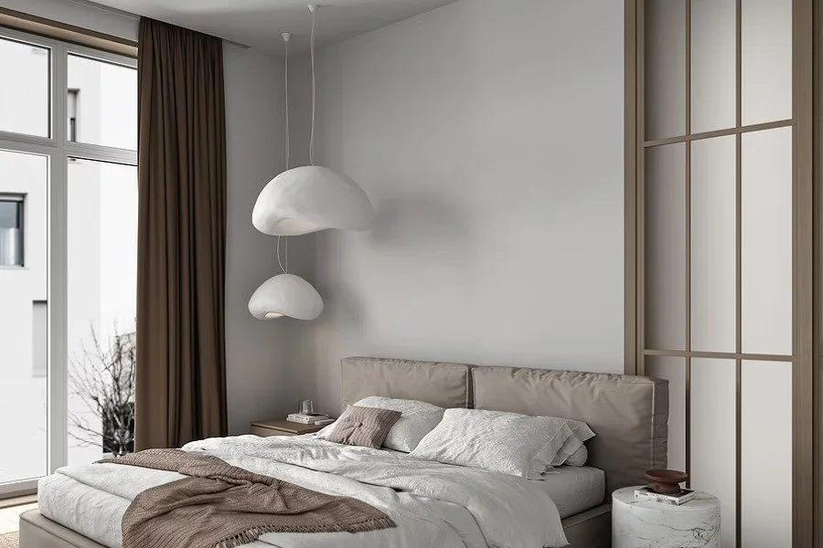 Curtains Singapore full-height brown curtains in a modern bedroom with large windows, neutral bedding, and a spacious minimalist design.