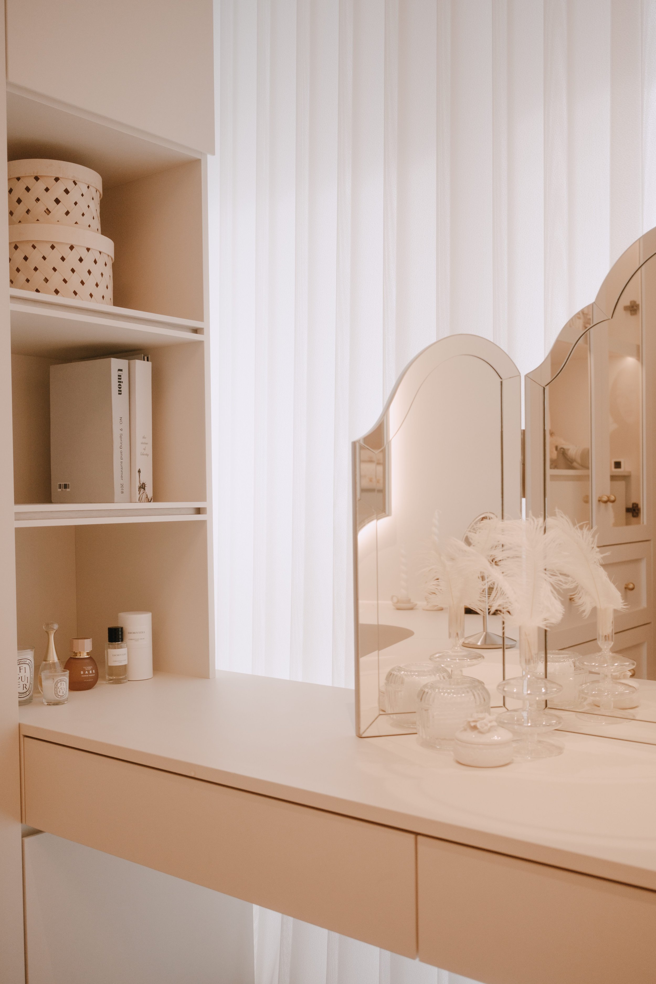 Ripple Blinds behind a vanity table, adding soft light and privacy to a feminine dressing area.