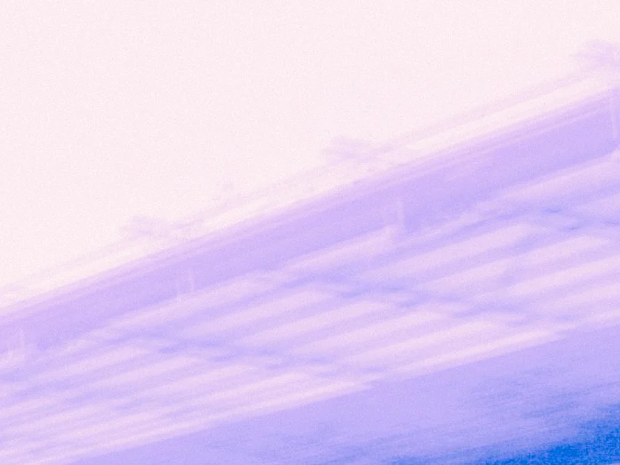Abstract sky with light purple and white clouds.