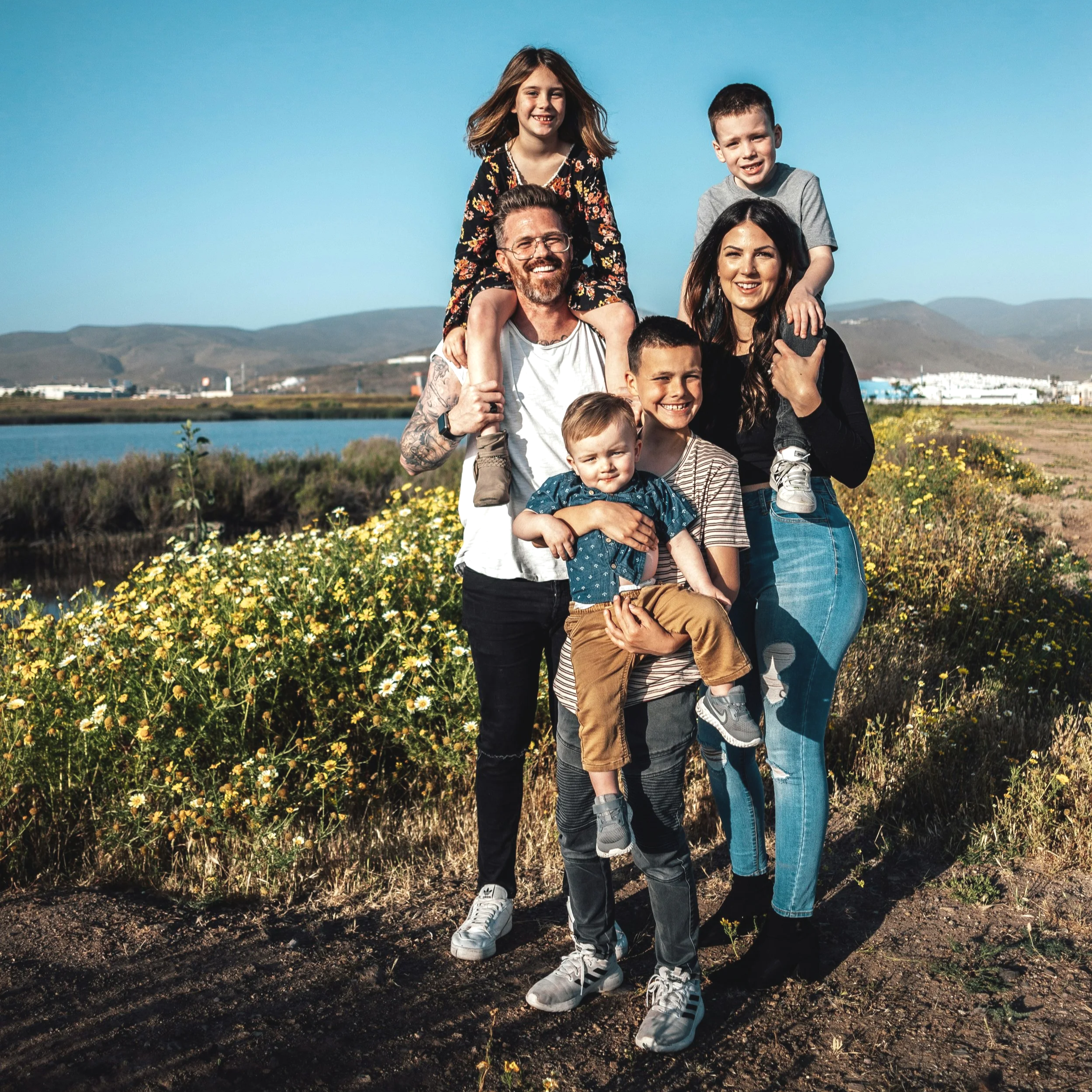 A young family out walking near the sea. Used to illustrate an article that family history could be under-recognised in lung cancer.