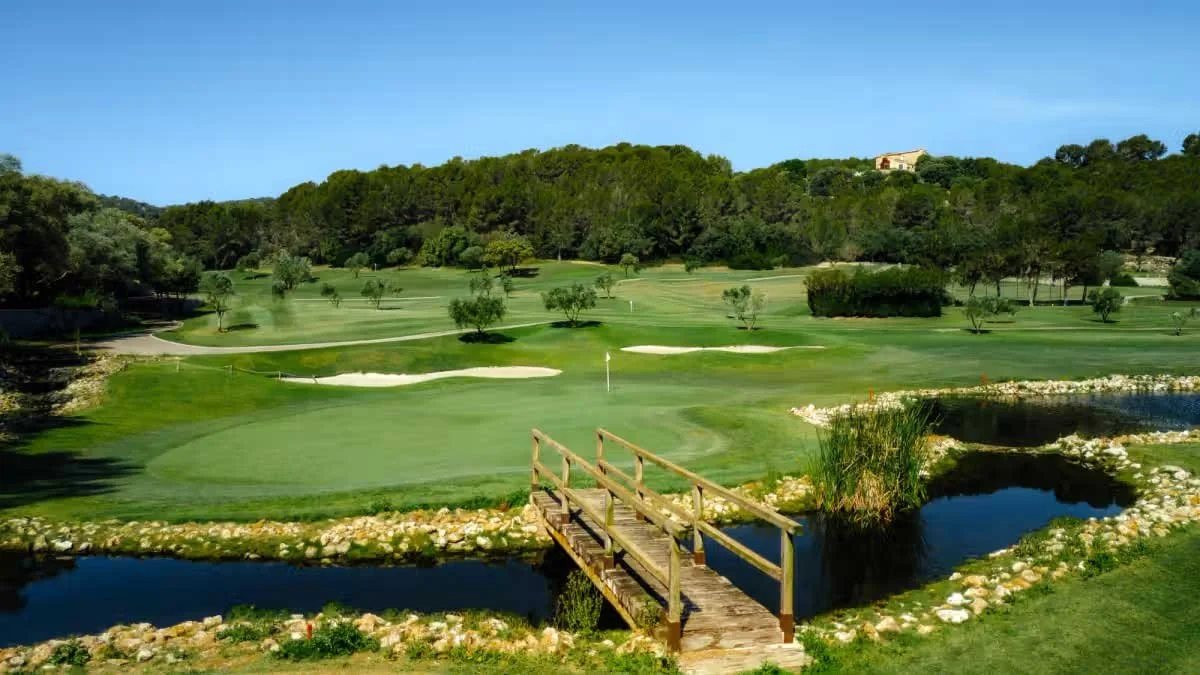 Wooden footbridge over the water to a green at Son Muntaner, Arabella Golf Mallorca