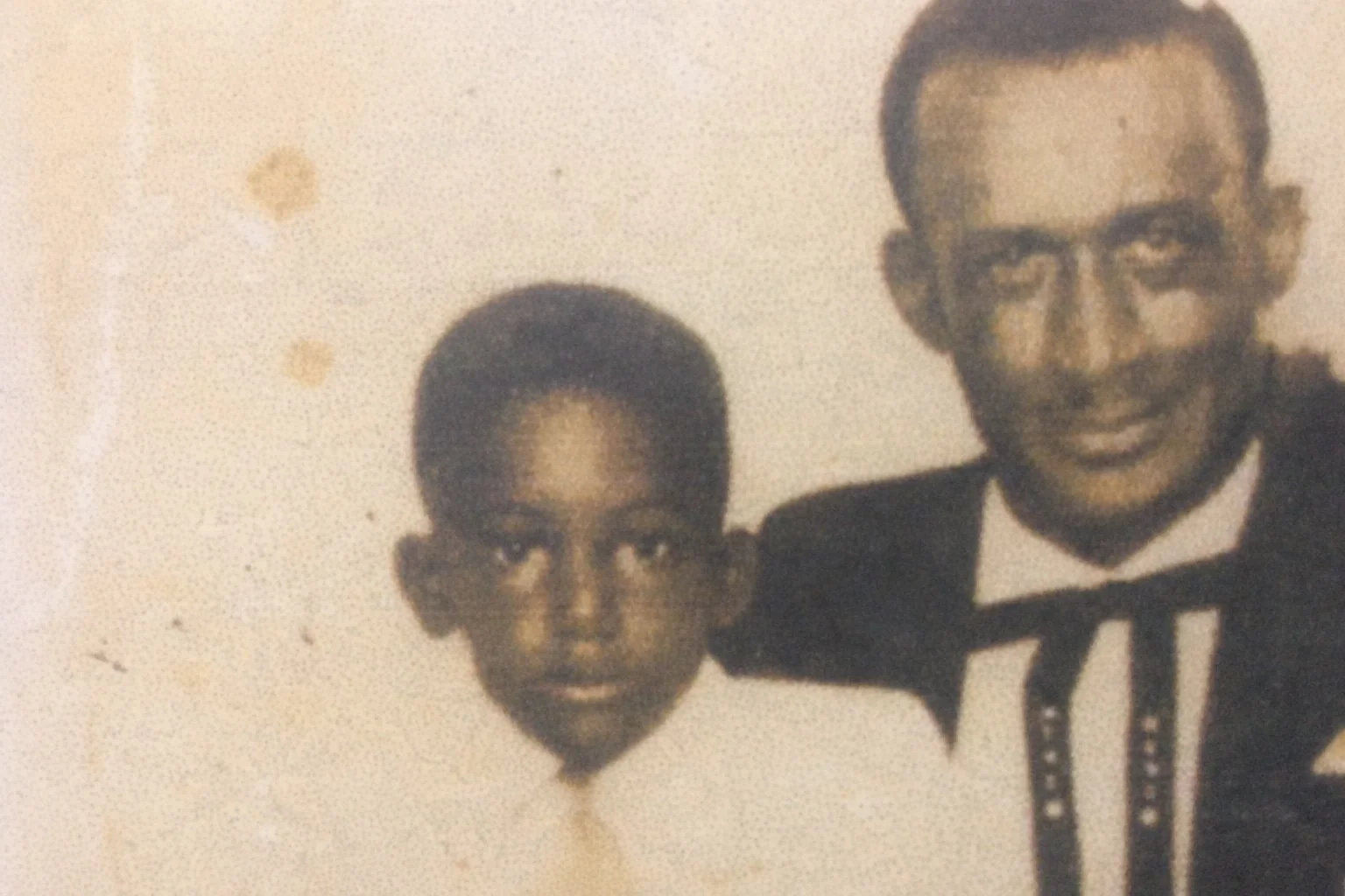 Old image of Mac as a child with his father.