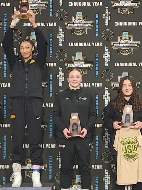 March 7, 2026-May LIVING BIG on the podium with Jack's shirt for the INAUGURAL YEAR of Women's NCAA Wrestling Championships!