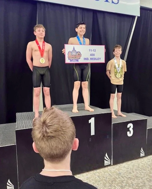 March 14, 2026-Jack's cousin, Simon, LIVING BIG on the podium with Jack's shirt! 
