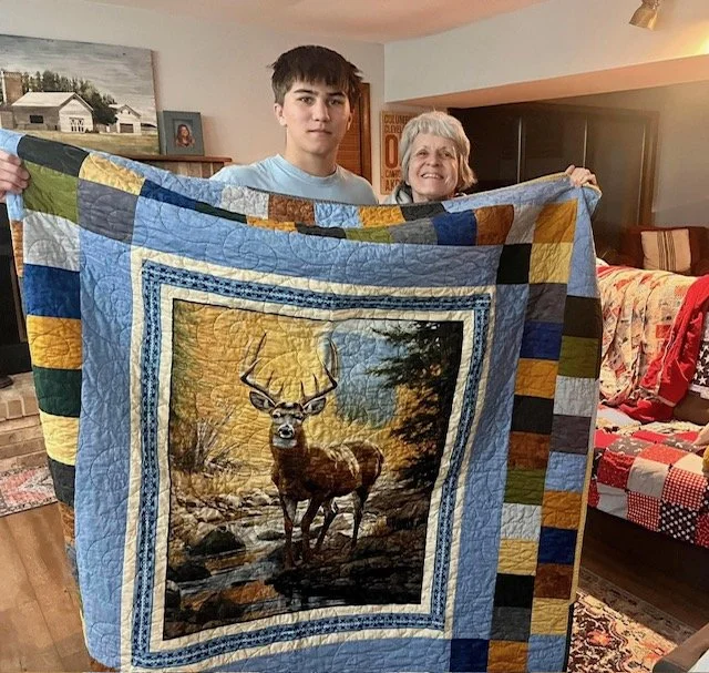 March 14, 2026-Grammy Pam reminded Leland to LIVE BIG with this beautiful quilt she made! 