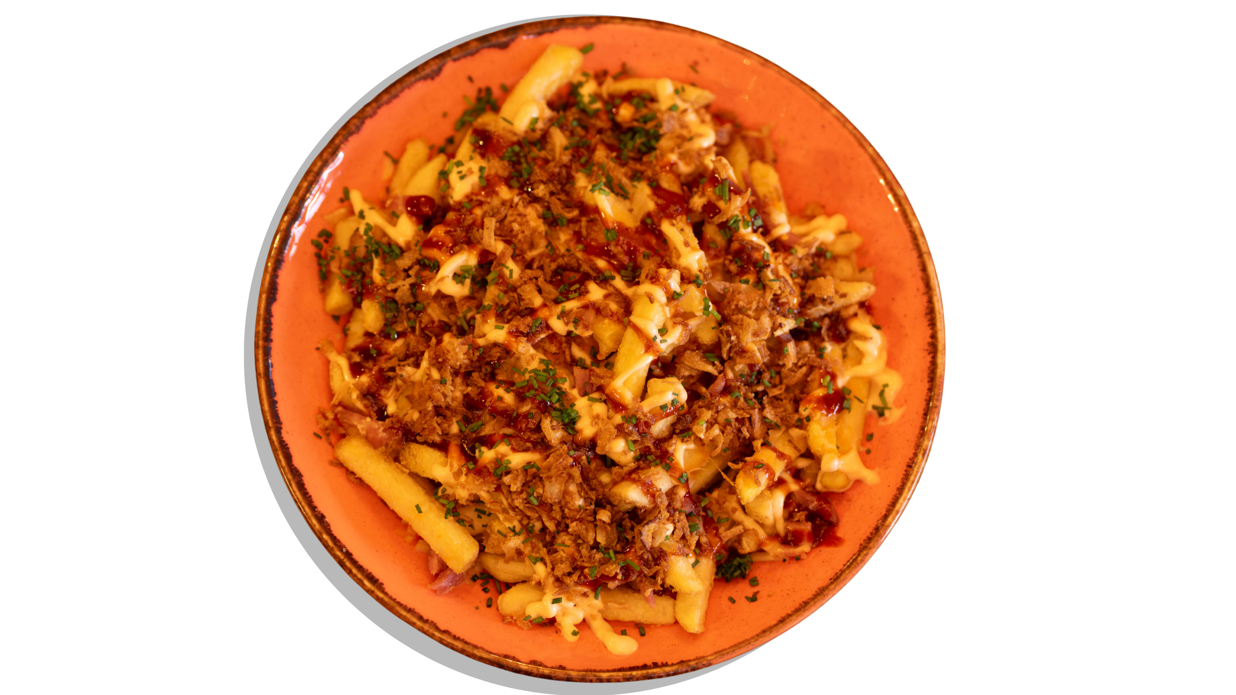 Plate of loaded fries topped with cheese, cooked ground meat, chopped herbs, and sauce.
