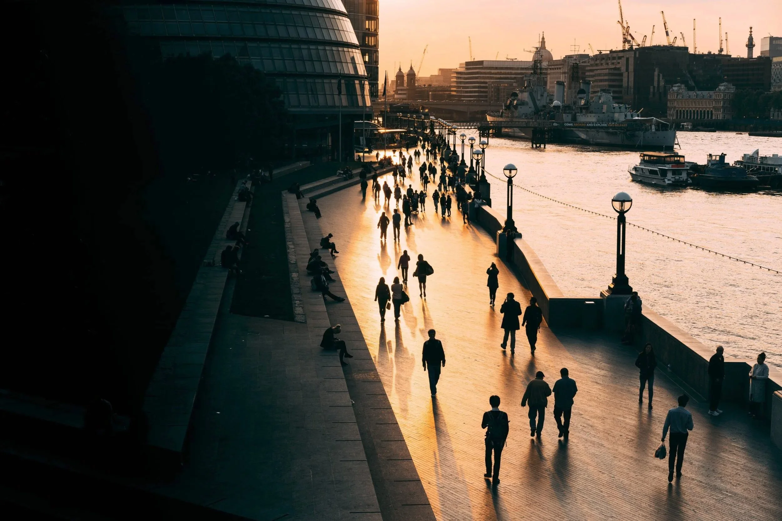 People walking down boardwalk