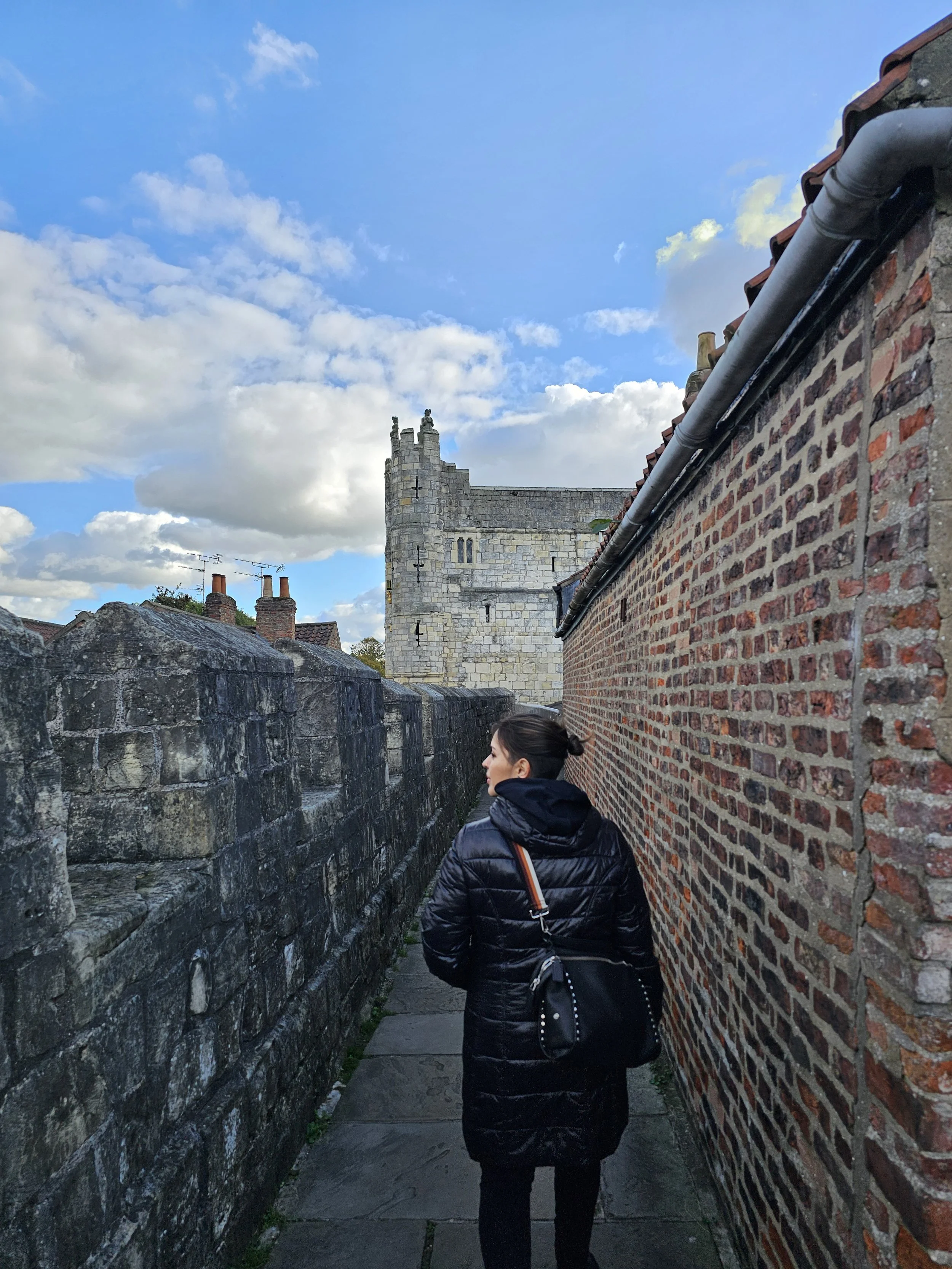 Photo of the back of author's profile while walking down castle turrets.
