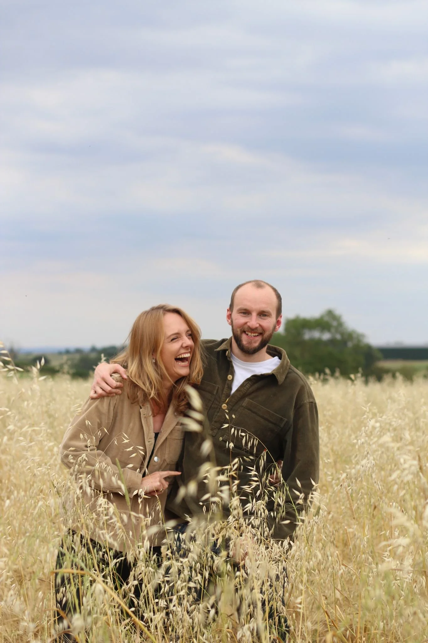 our founders in a field of oats