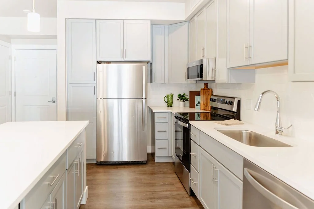 Kitchen with stainless steel appliances in the one bedroom condo.
