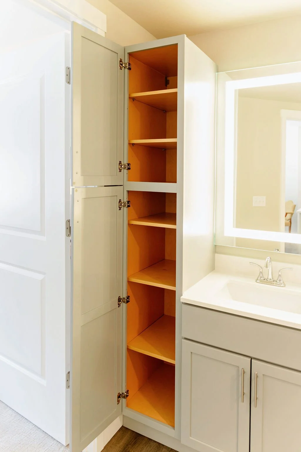 Cabinet space in bathroom.
