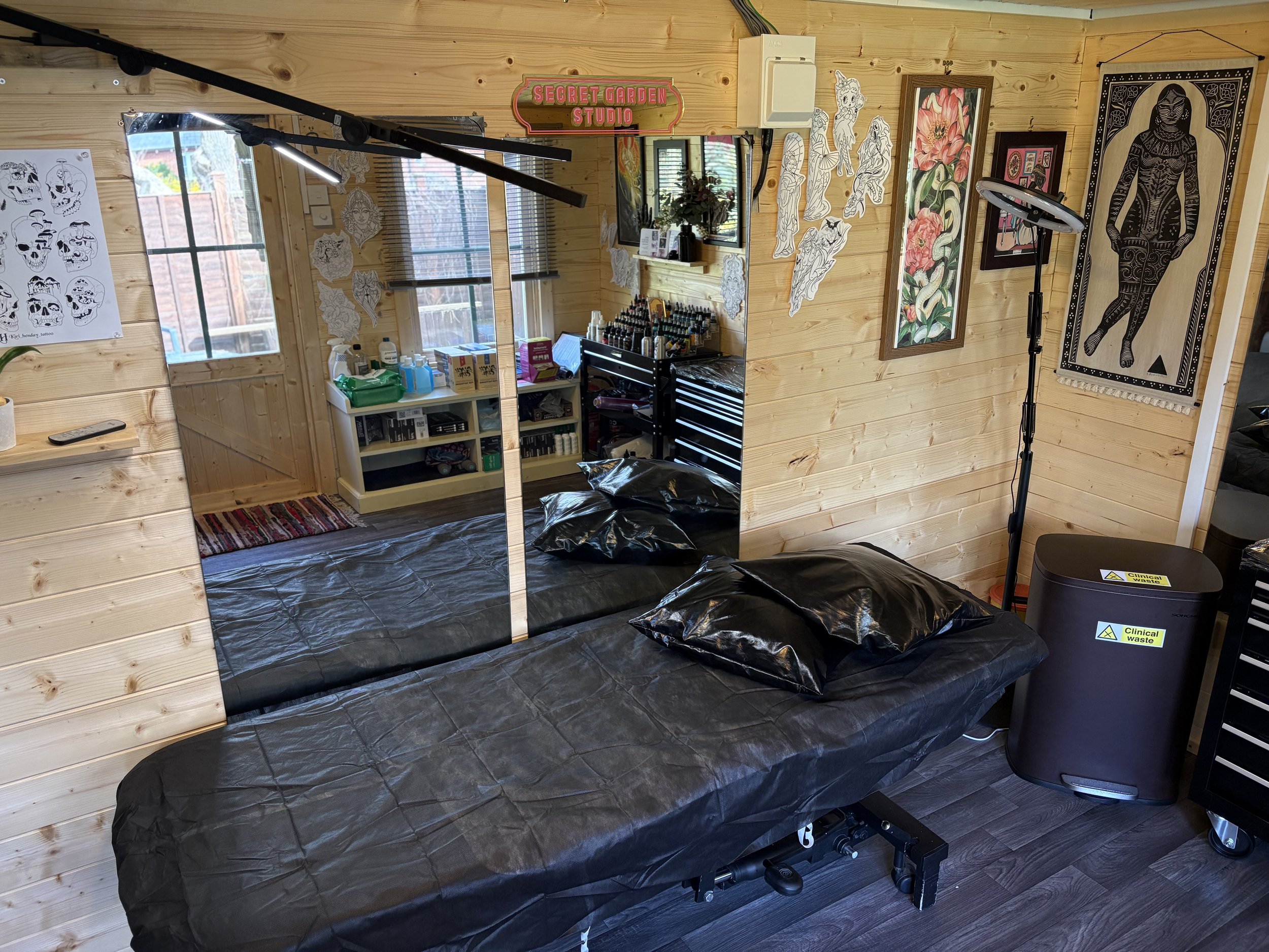 Tattoo treatment bed in pine walled tattoo studio 