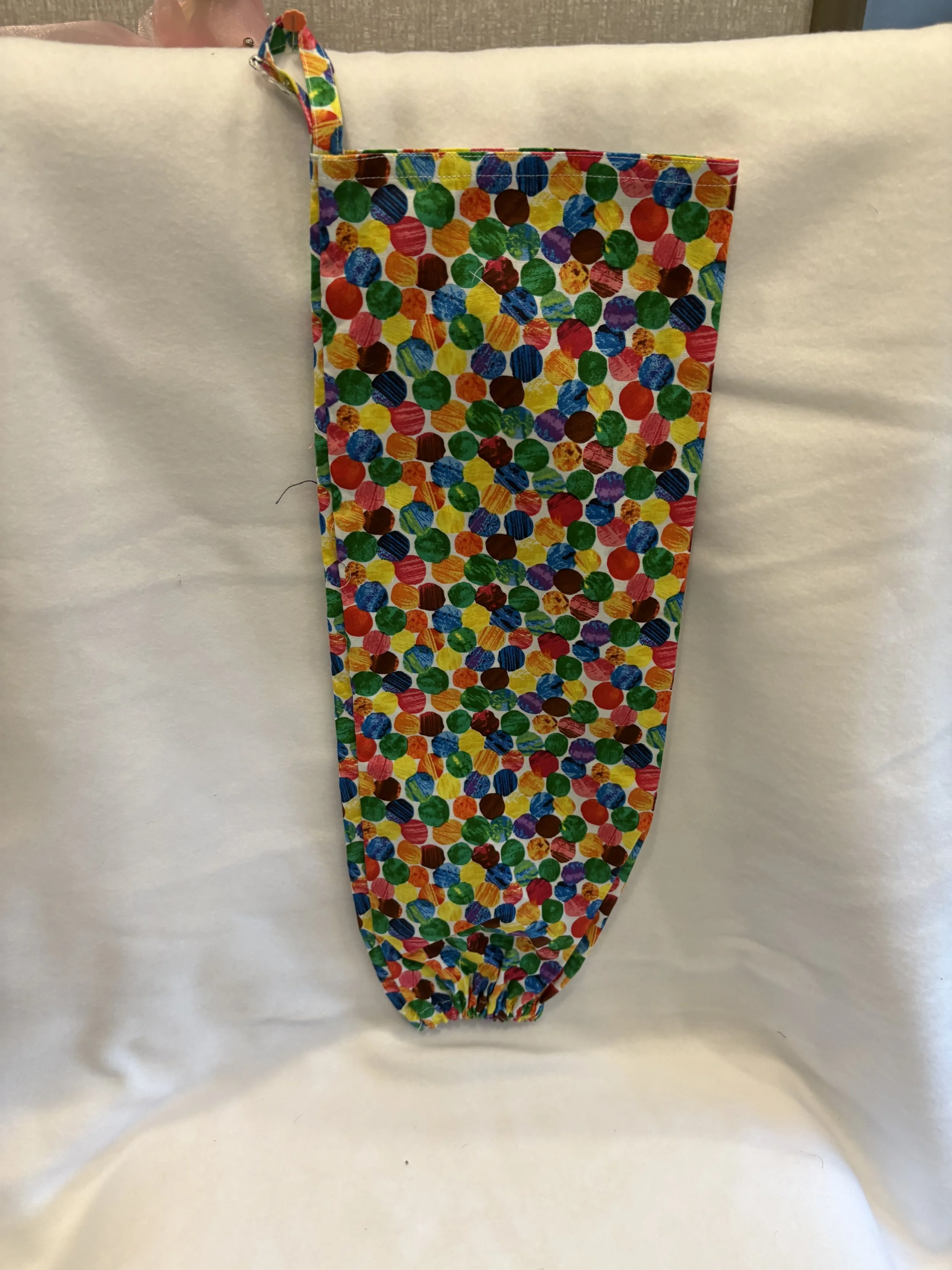 Bright colored fabric plastic bag dispenser