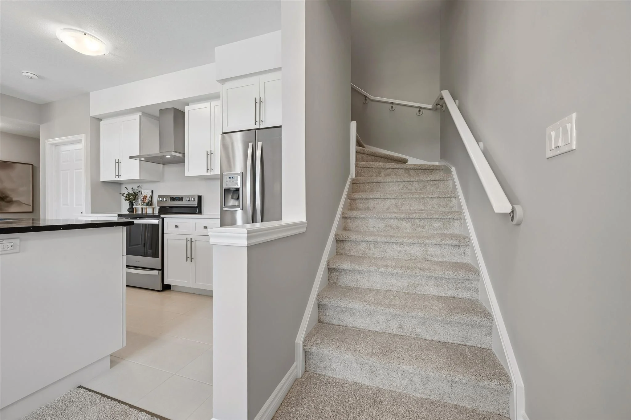 8 Oat Lane — Upgraded staircase off the kitchen