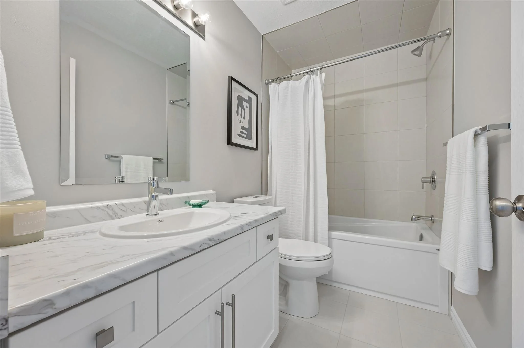 8 Oat Lane — Main bathroom with shaker vanity and tub/shower